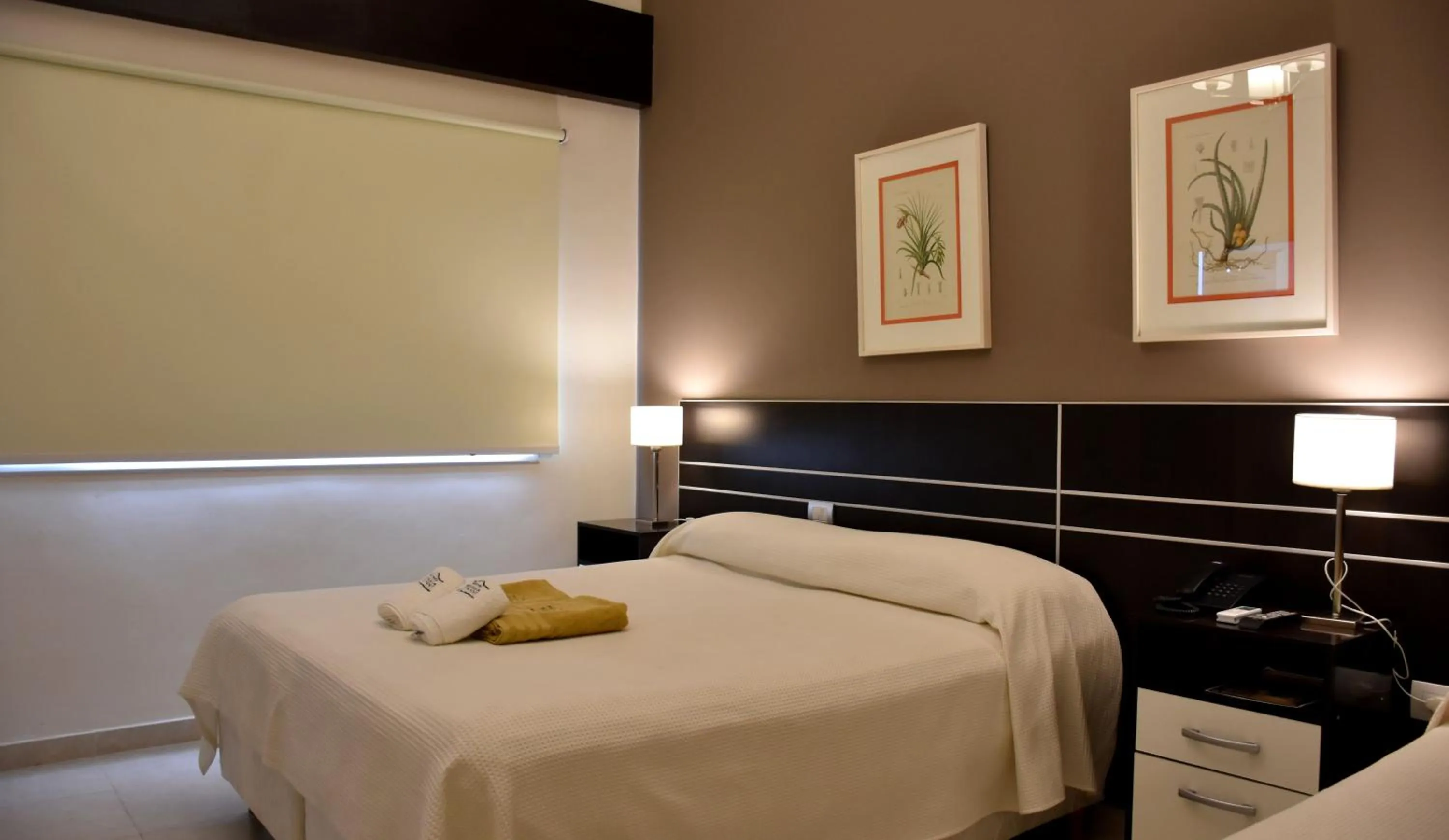 Photo of the whole room, Bed in Hostería Atahualpa Yupanqui