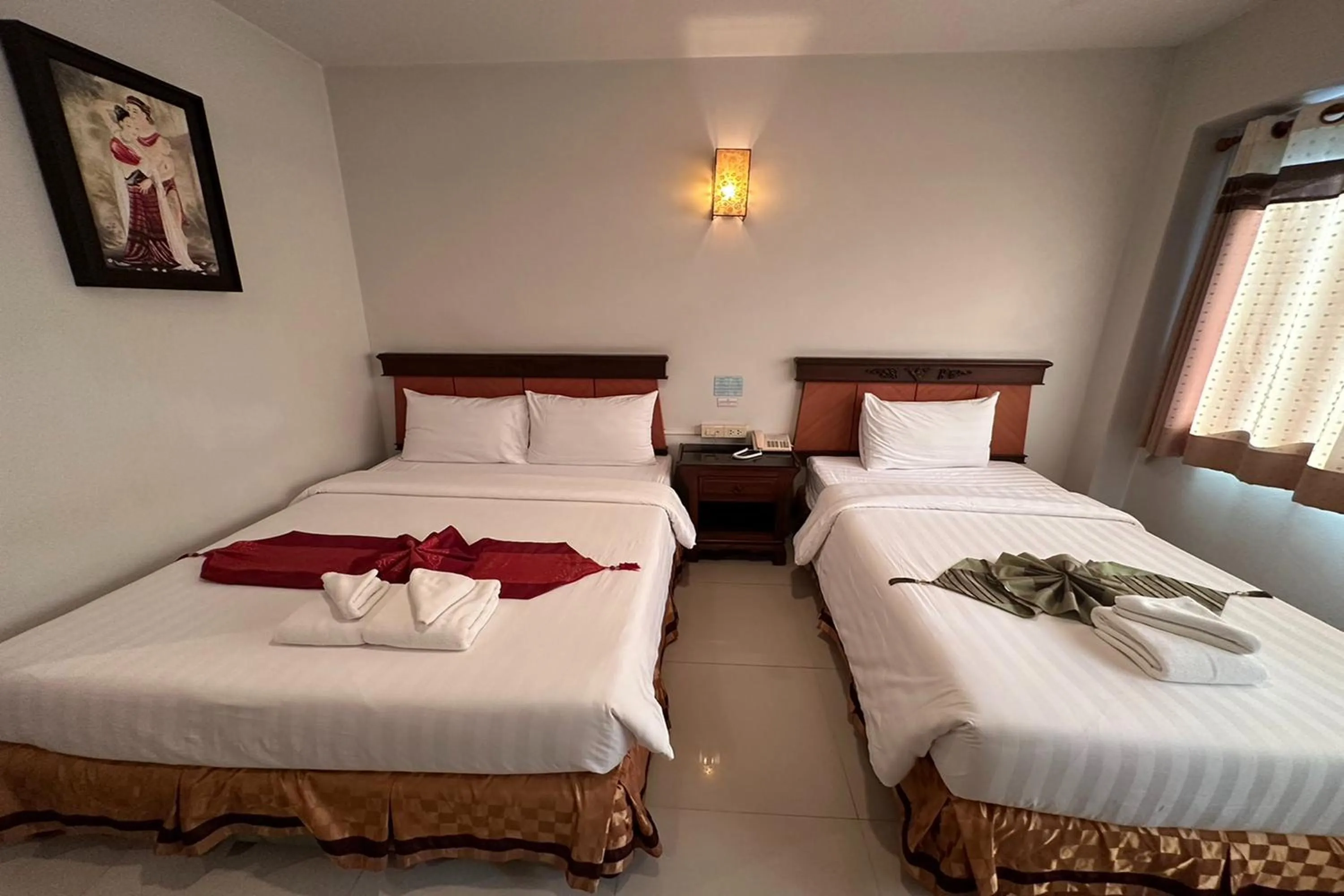 Bed in Chiangrai Grand Room Hotel