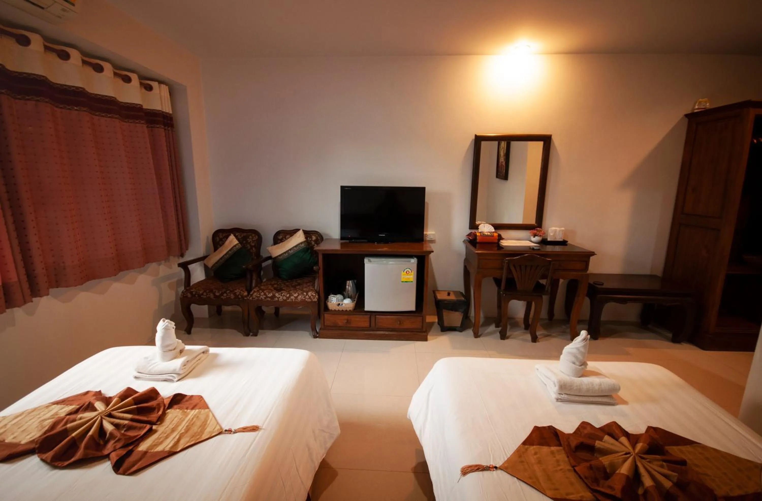 Bed in Chiangrai Grand Room Hotel