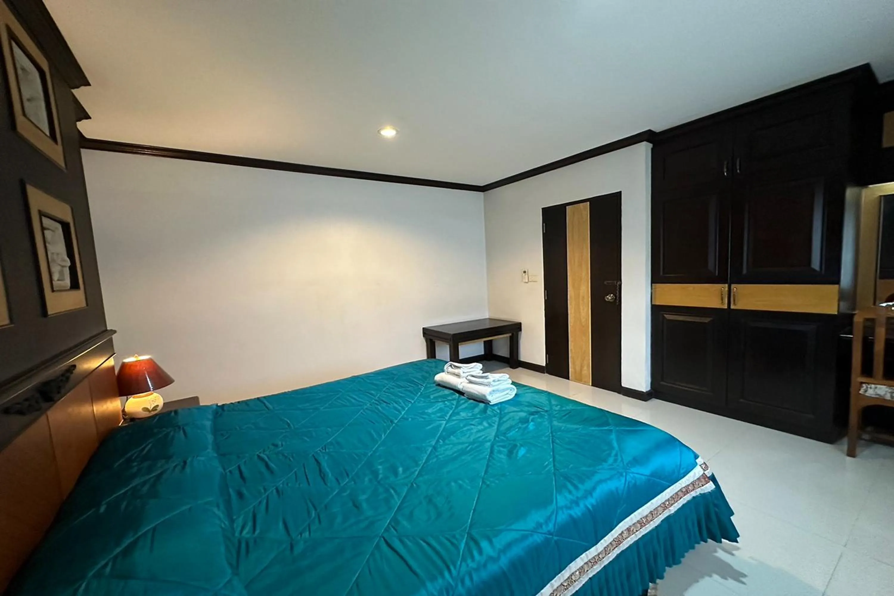 Bed in Chiangrai Grand Room Hotel