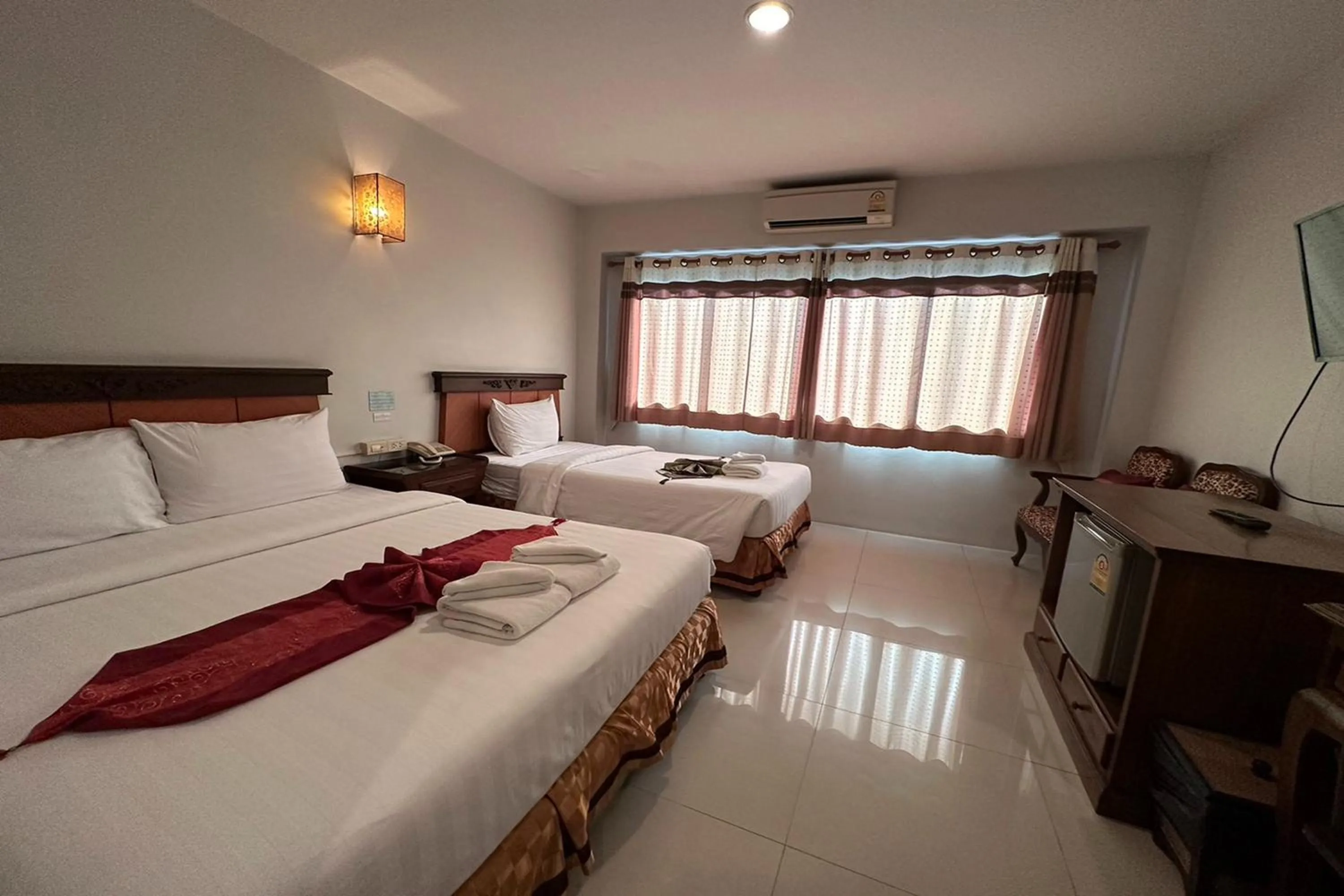 Bed in Chiangrai Grand Room Hotel