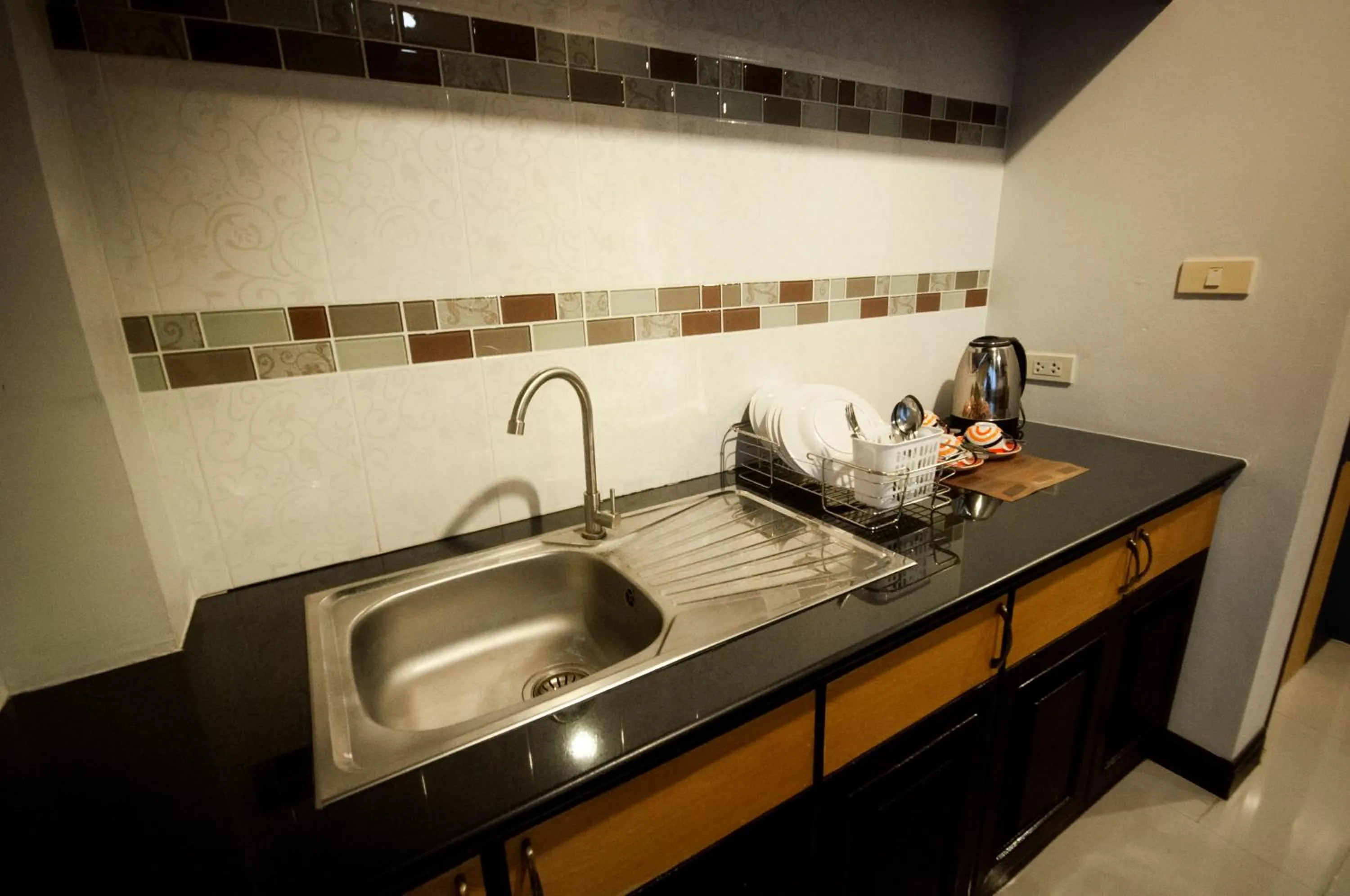 Kitchen or kitchenette in Chiangrai Grand Room Hotel