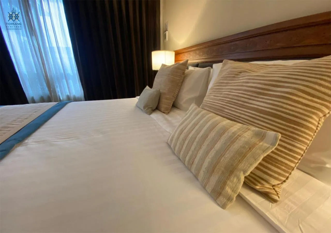 Bed in Tohsang Heritage Ubon Hotel