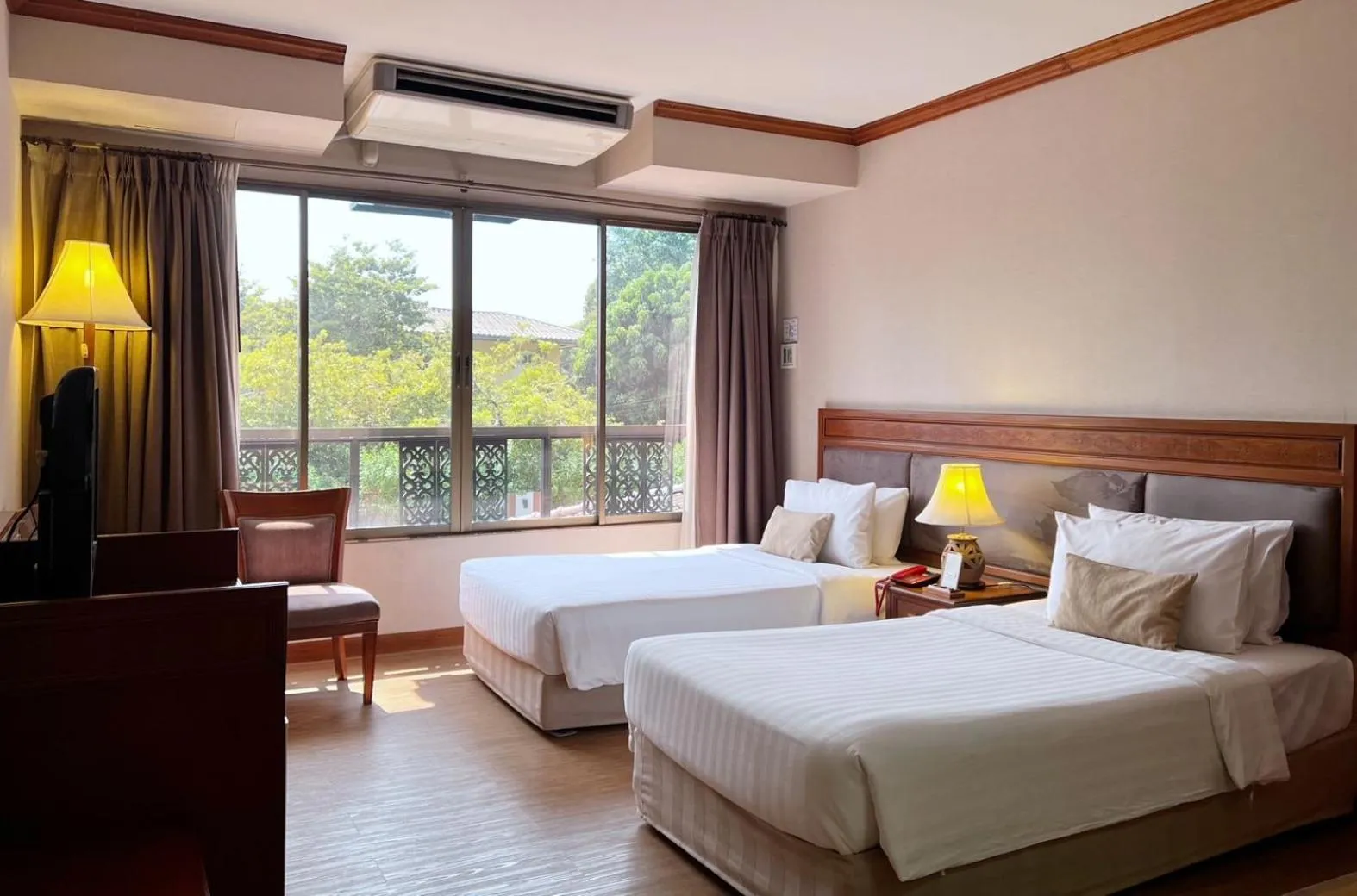 Bed in Tohsang Heritage Ubon Hotel