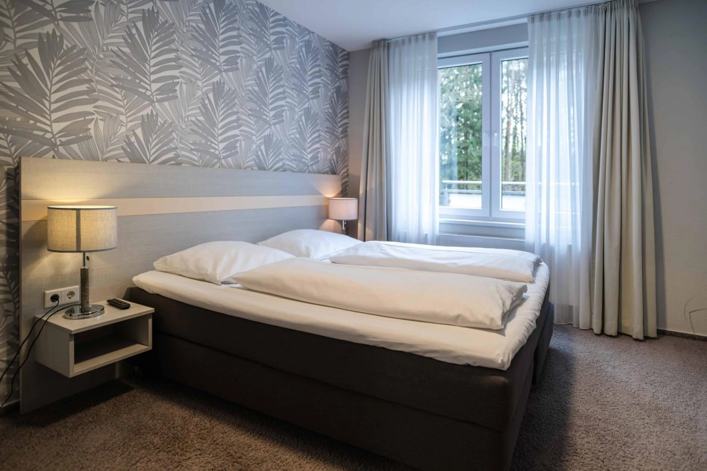 Photo of the whole room, Bed in Hotel des Nordens Flensburg Wellness & Spa