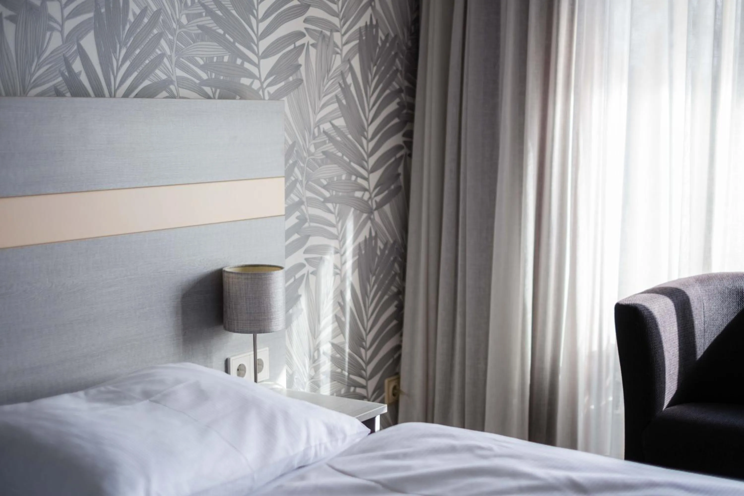 Photo of the whole room, Bed in Hotel des Nordens Flensburg Wellness & Spa