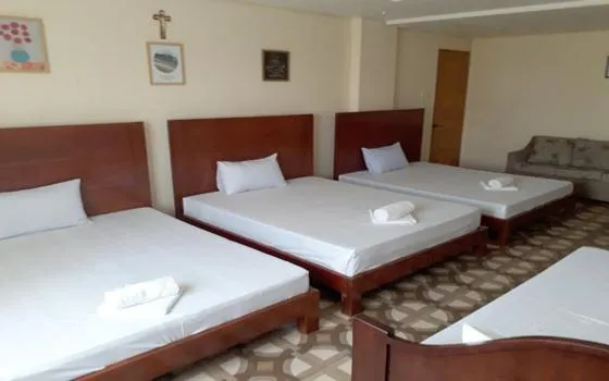 Bed in WMV Hotel & Restaurant