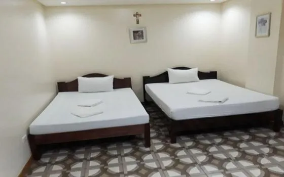 Bed in WMV Hotel & Restaurant