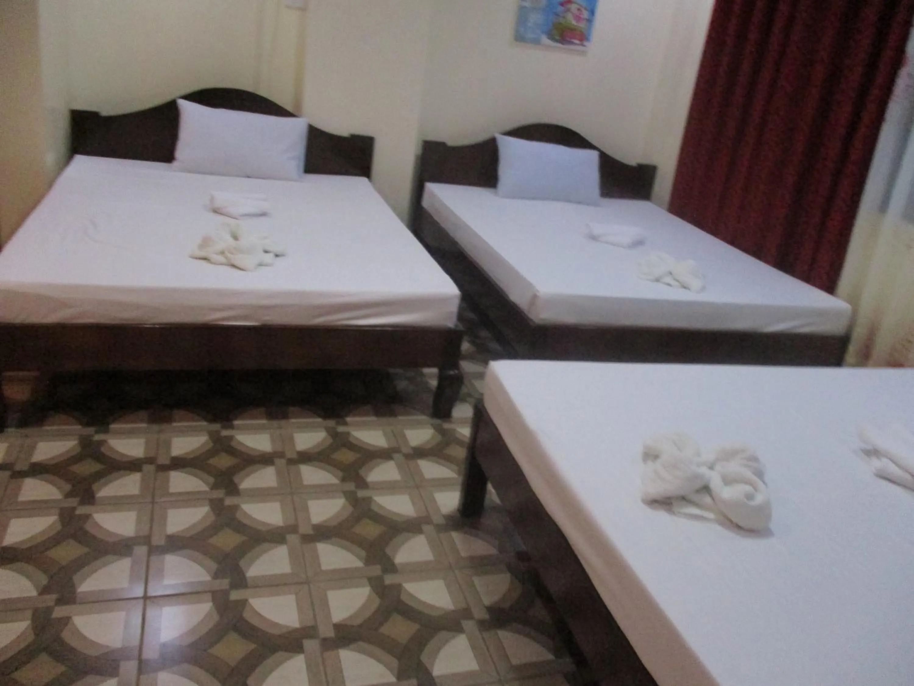 Bed in WMV Hotel & Restaurant