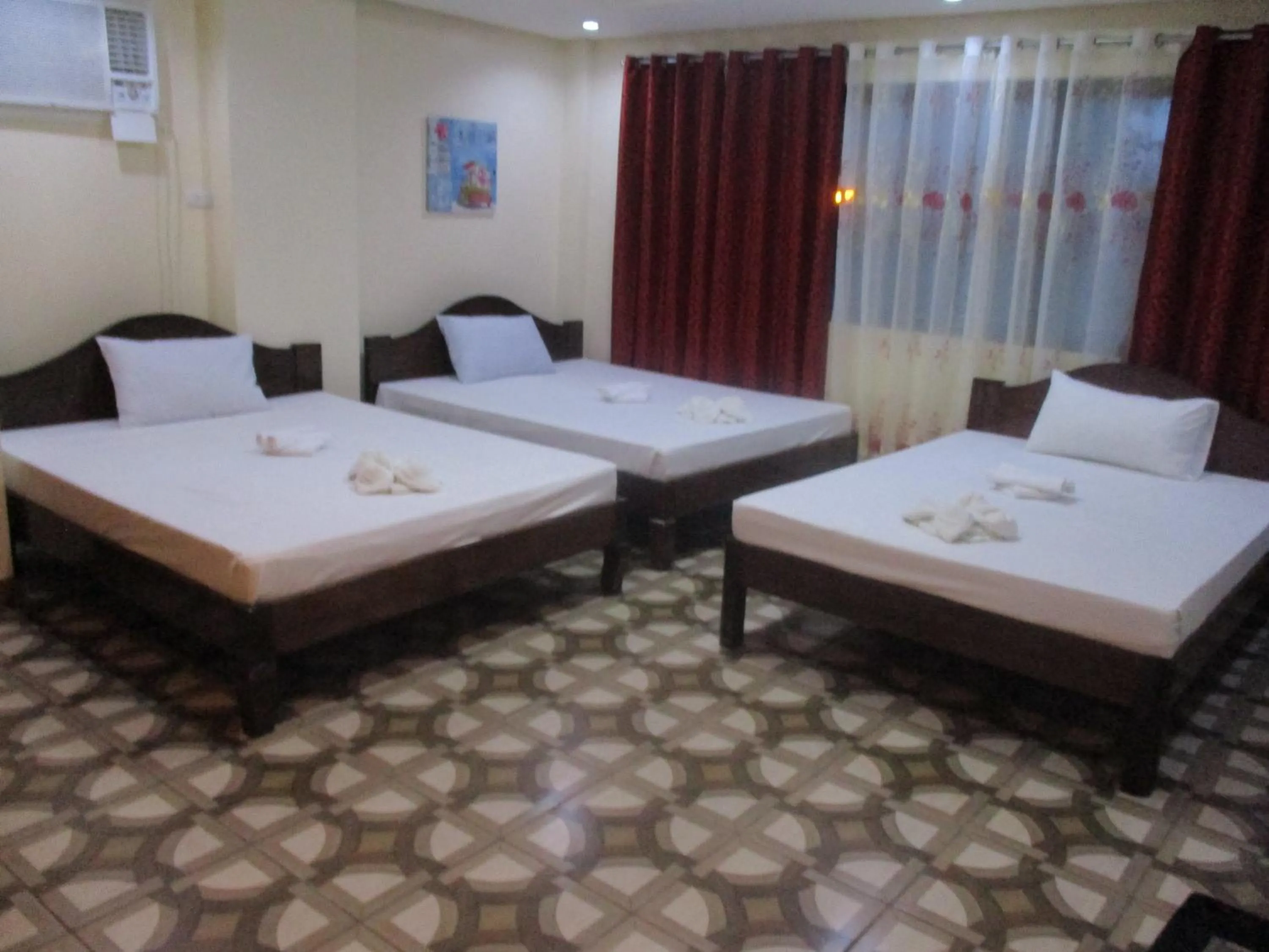 Bed in WMV Hotel & Restaurant