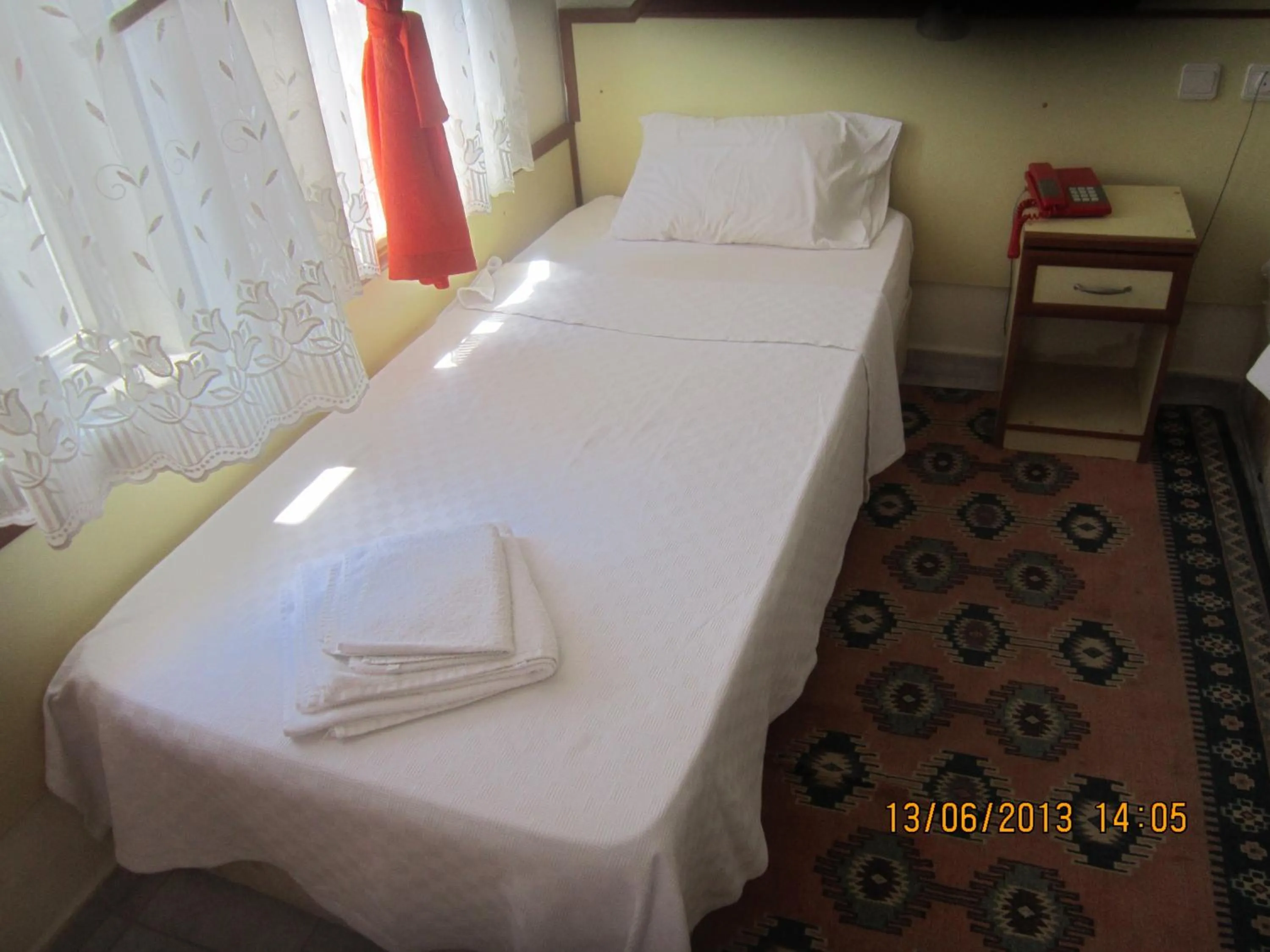Bed in Red Rose Hotel
