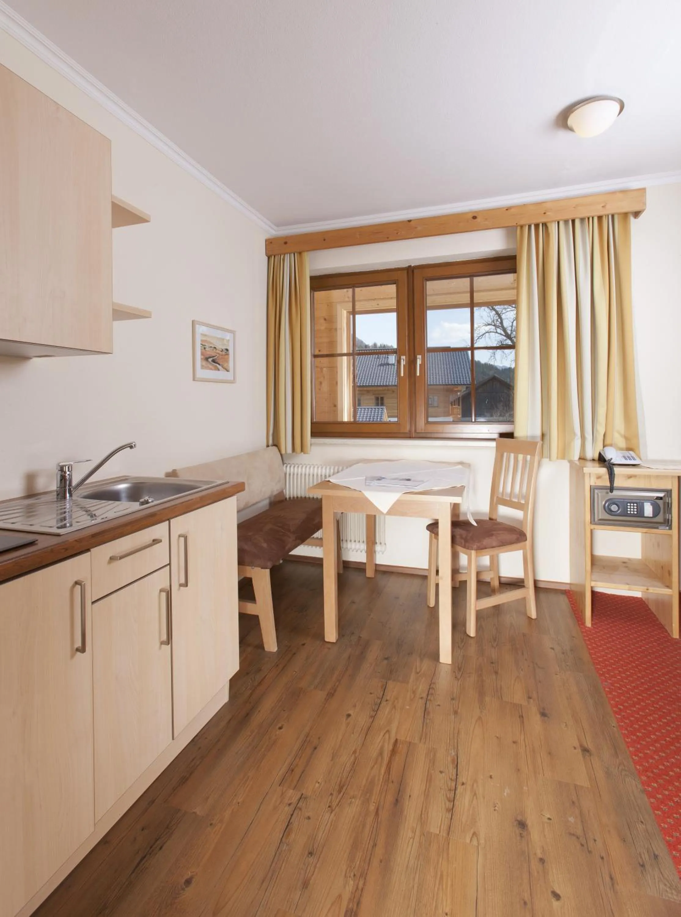 Kitchen or kitchenette in ApartHotel Holzerhof