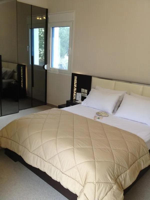 Bed in Pearl Bay Hotel Apartments