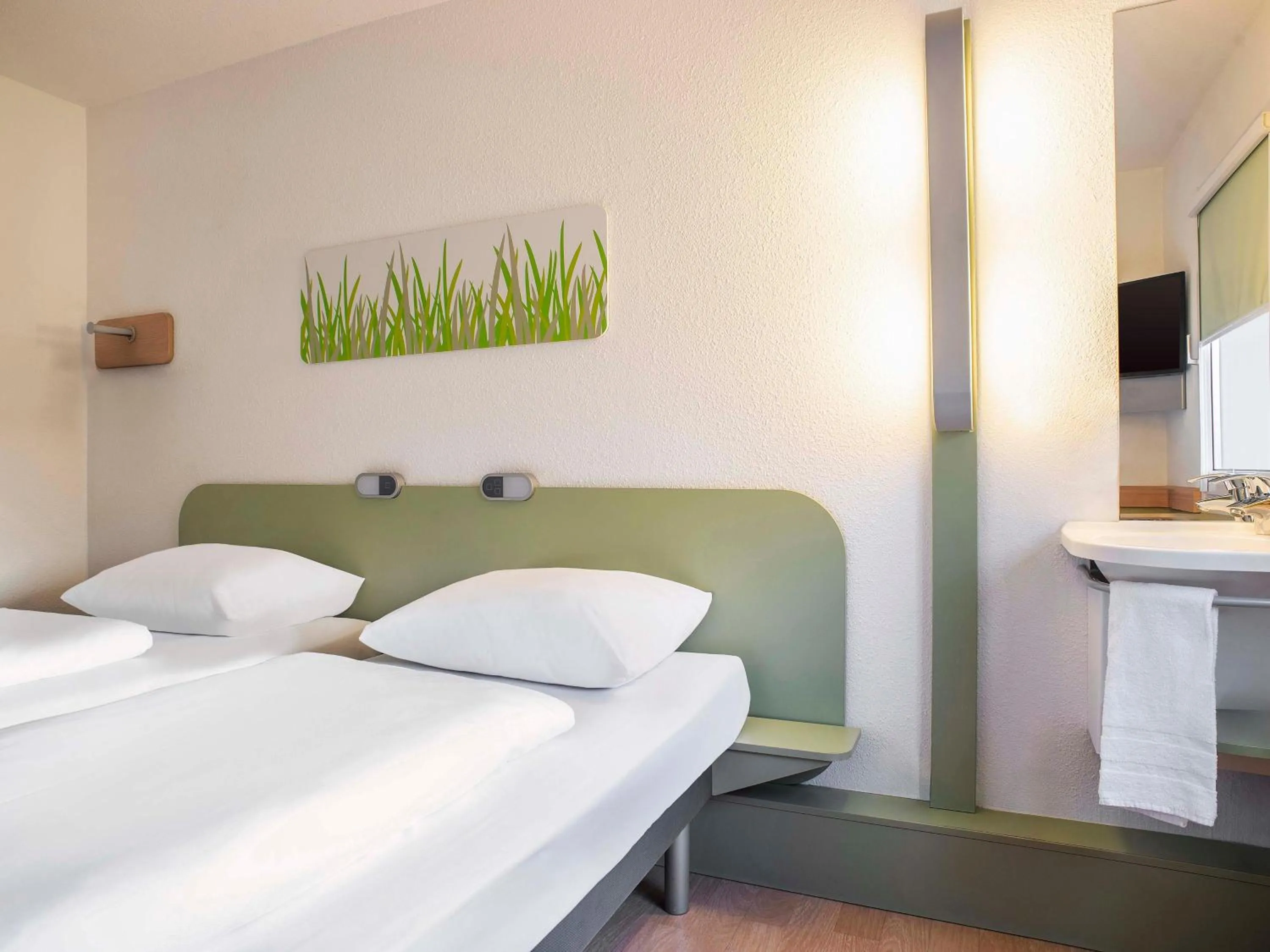 Photo of the whole room, Bed in B&B HOTEL Flensburg-City