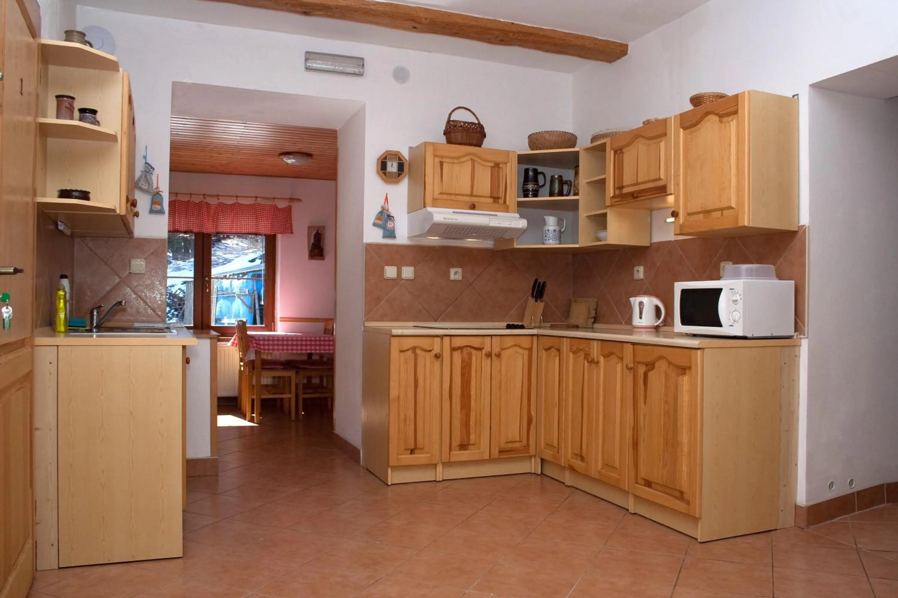 Kitchen or kitchenette in Penzion u Vodopádu