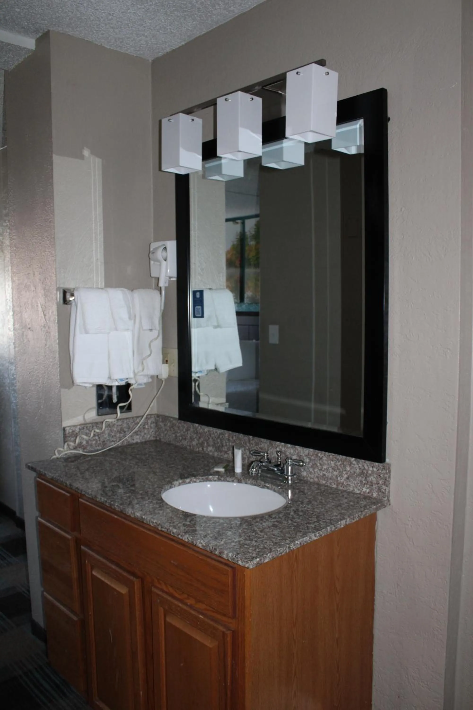 Bathroom in Days Inn & Suites by Wyndham Springfield on I-44