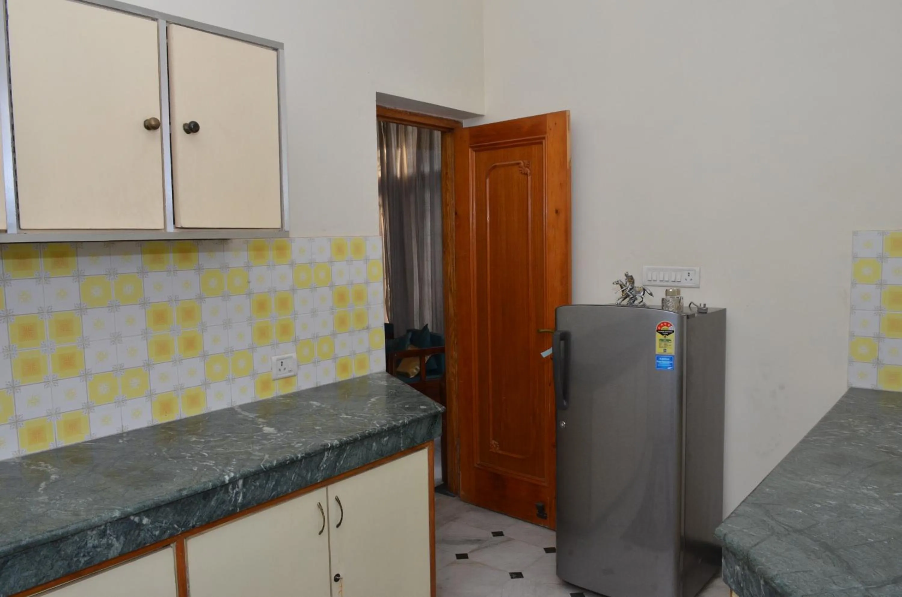 Kitchen or kitchenette in Sandy's Homestay