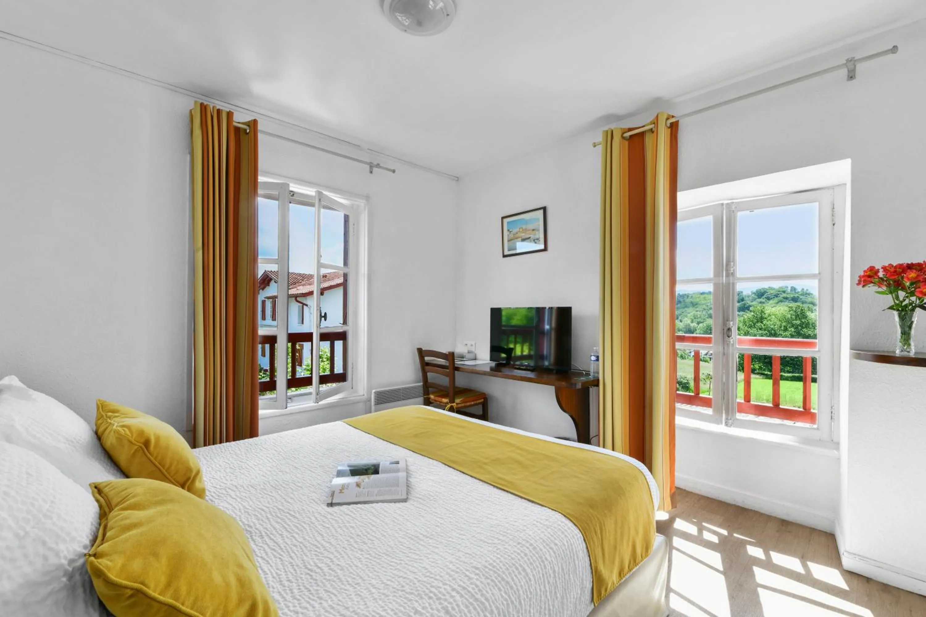 Bed in Logis Hôtel Baratxartea