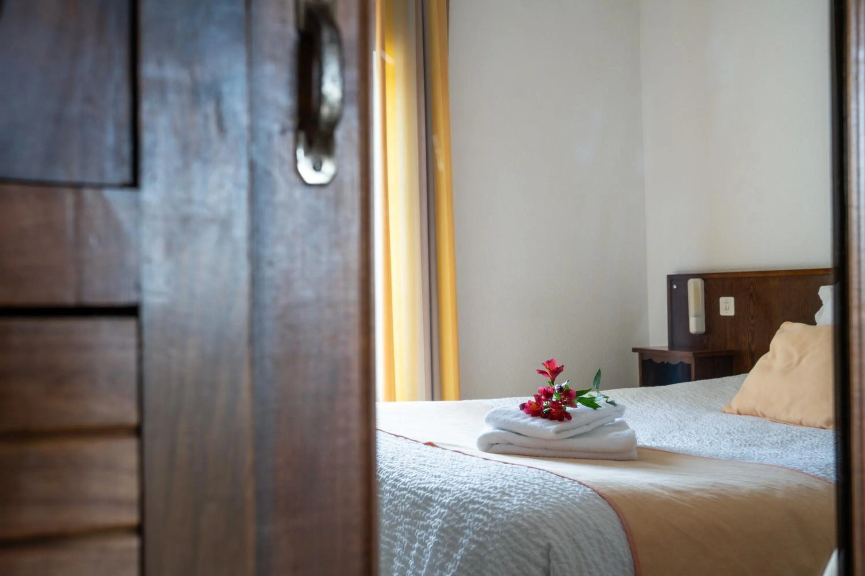 Bed in Logis Hôtel Baratxartea