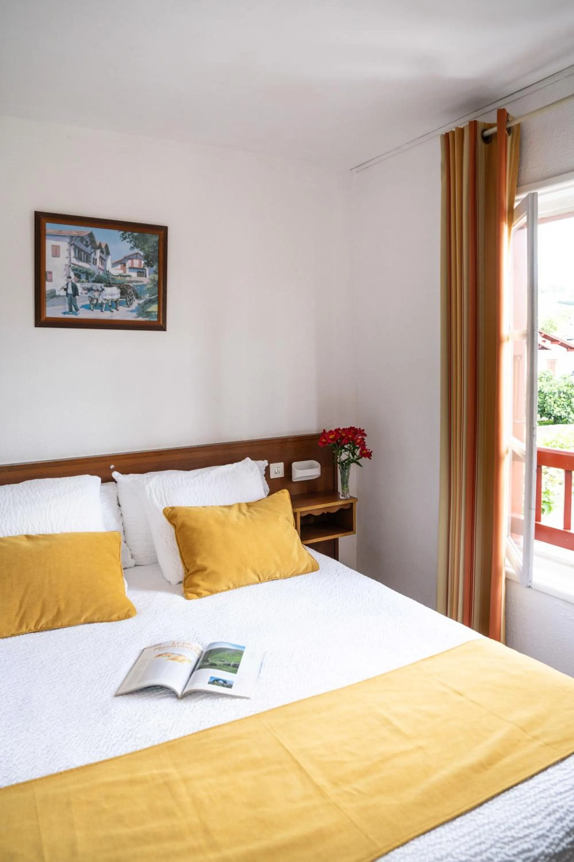 Bed in Logis Hôtel Baratxartea