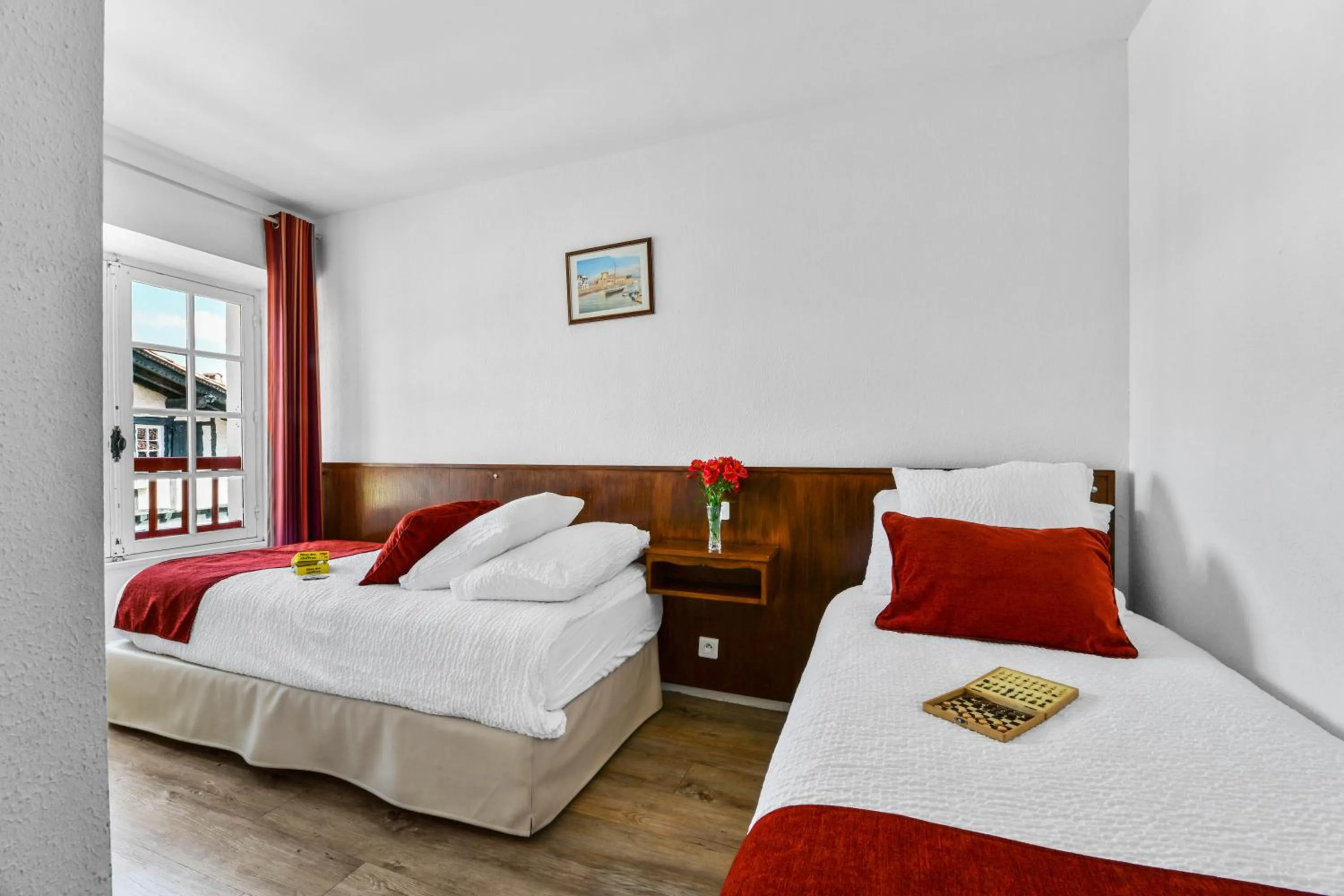 Bed in Logis Hôtel Baratxartea