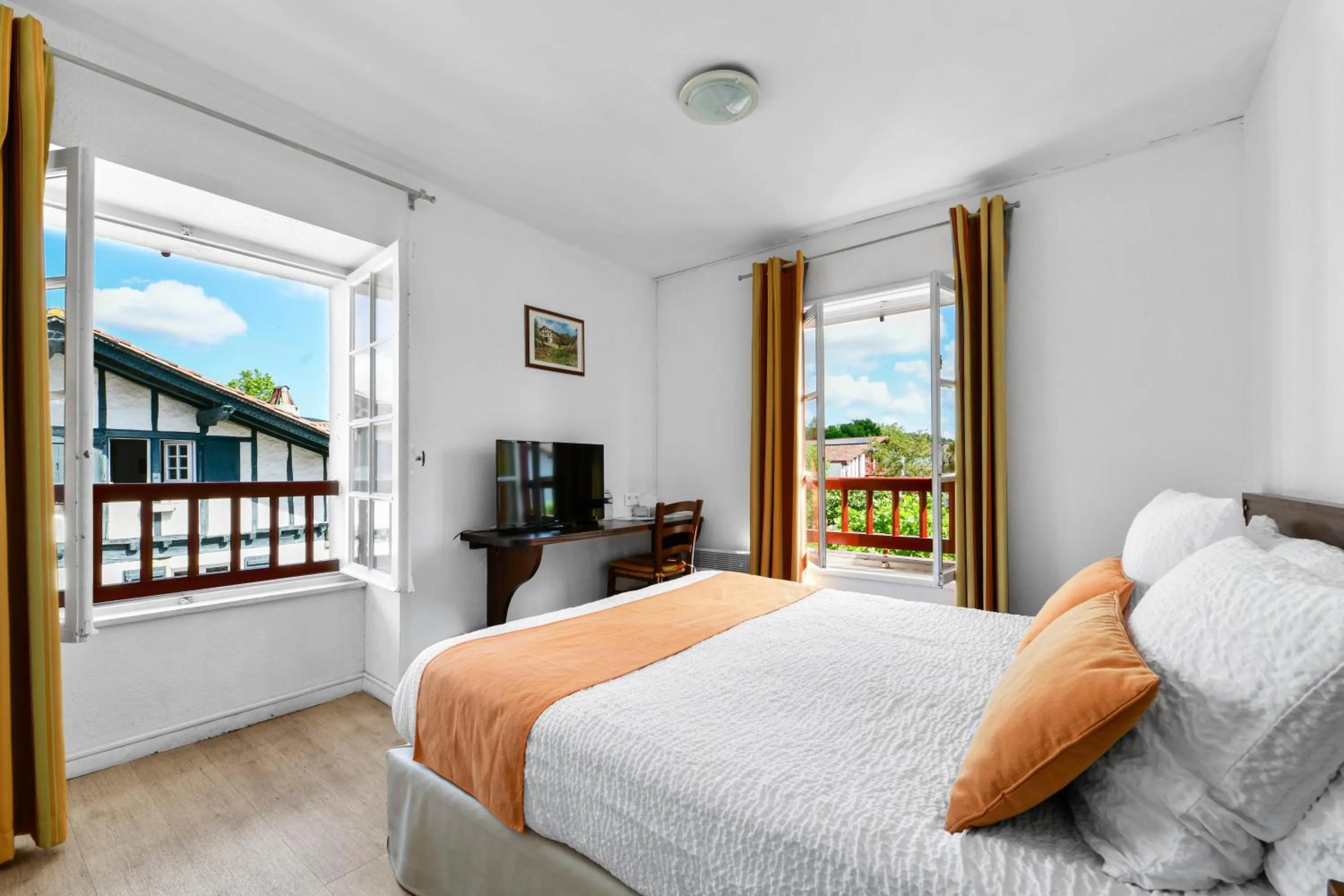 Bed in Logis Hôtel Baratxartea