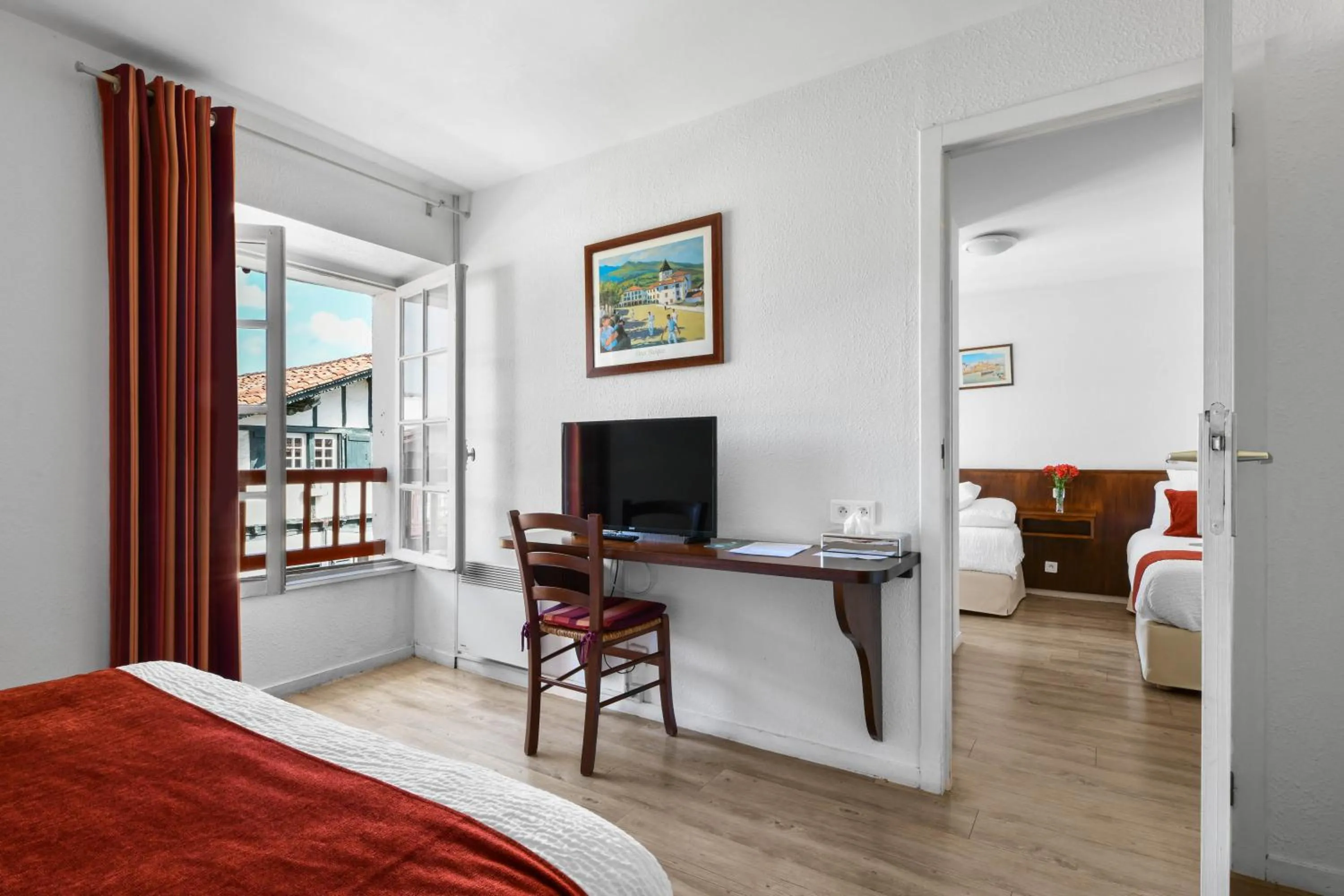 Bed in Logis Hôtel Baratxartea