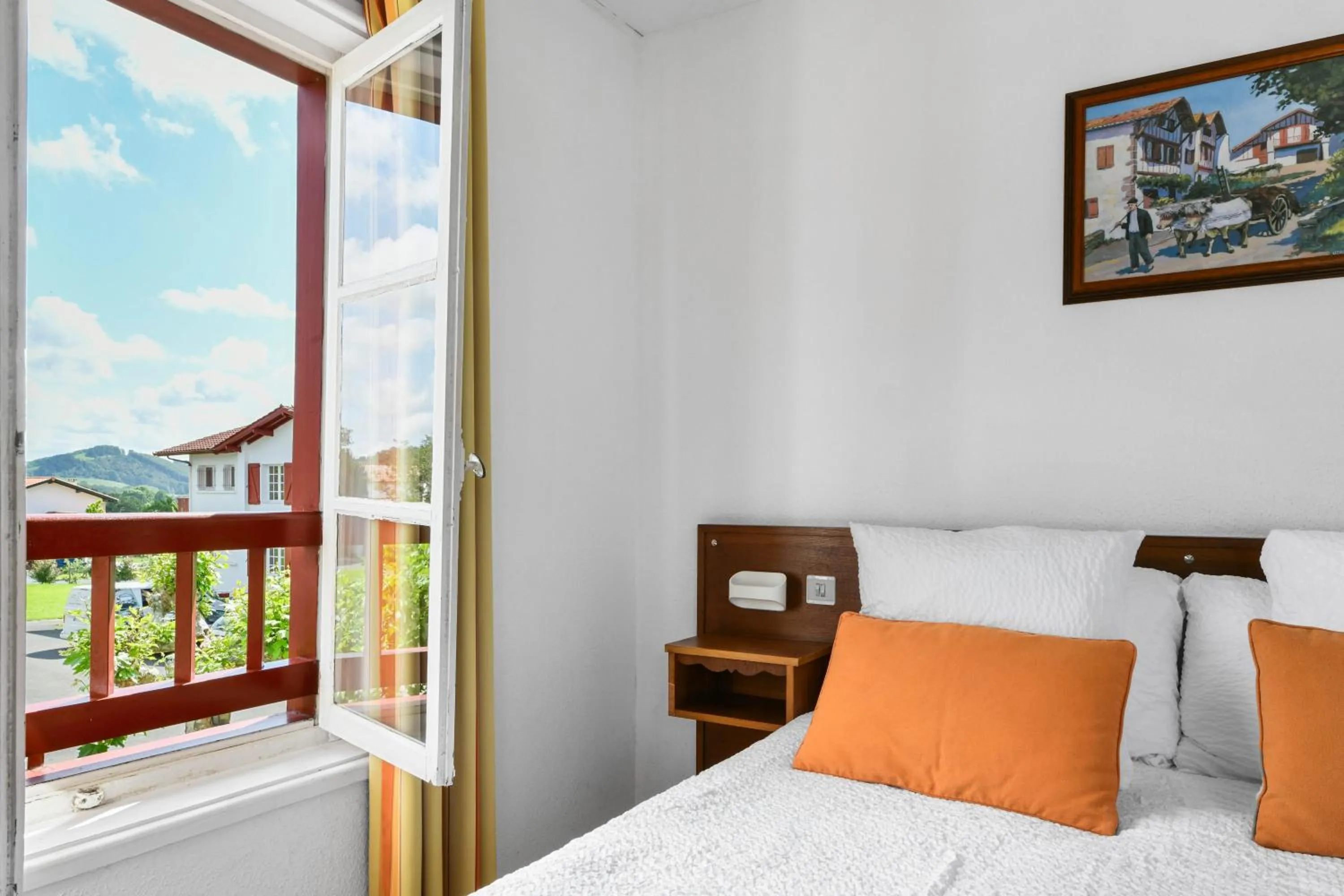 Bed in Logis Hôtel Baratxartea