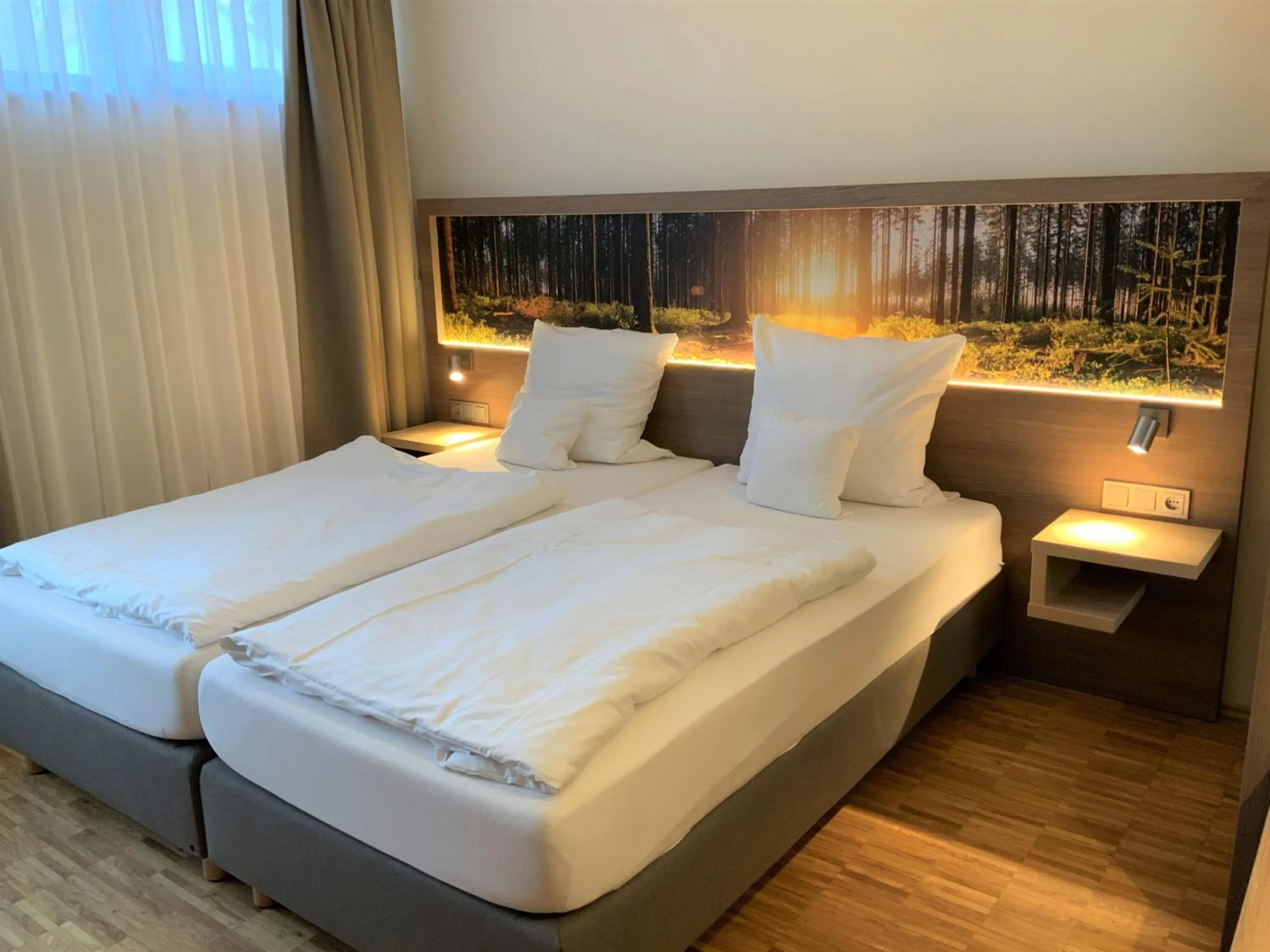 Photo of the whole room, Bed in SeminarZentrum Rückersbach