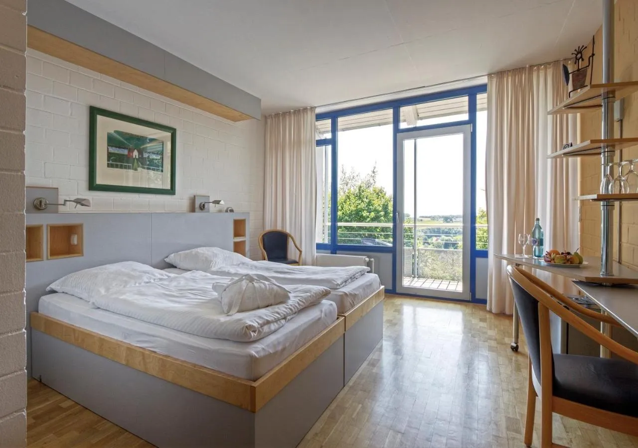 Photo of the whole room, Bed in SeminarZentrum Rückersbach