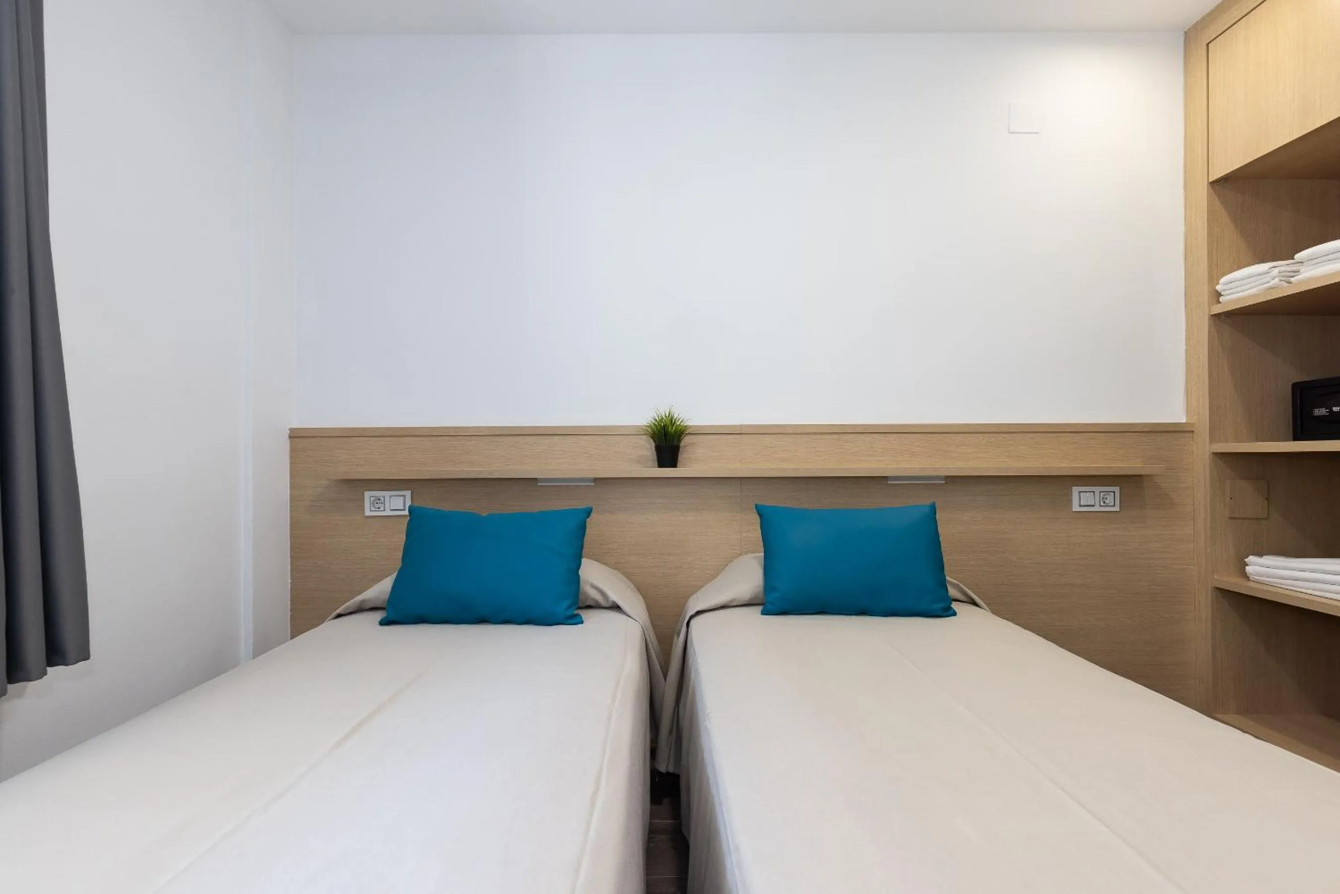 Bed in Rentalmar Zahara family suites