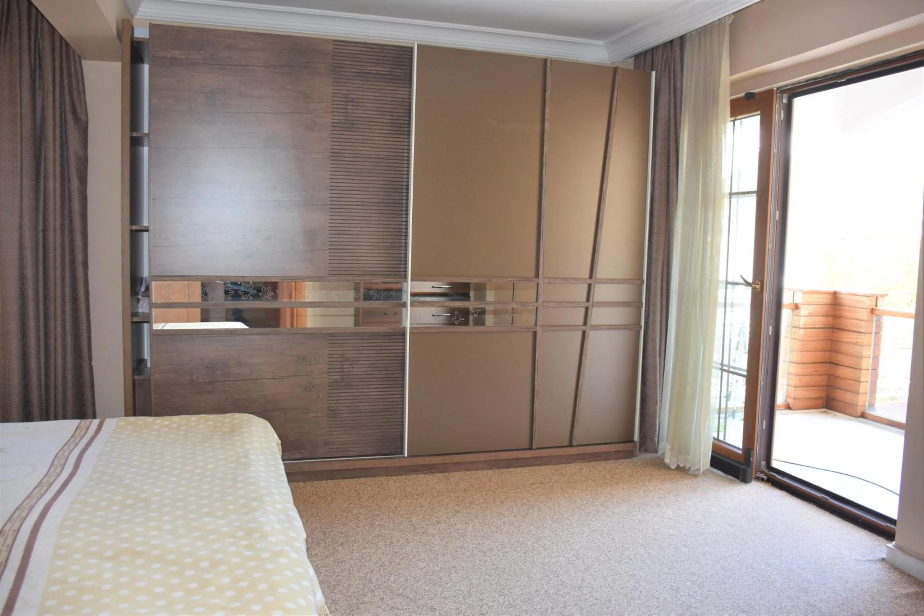 Bedroom in Dinara Apart Hotel