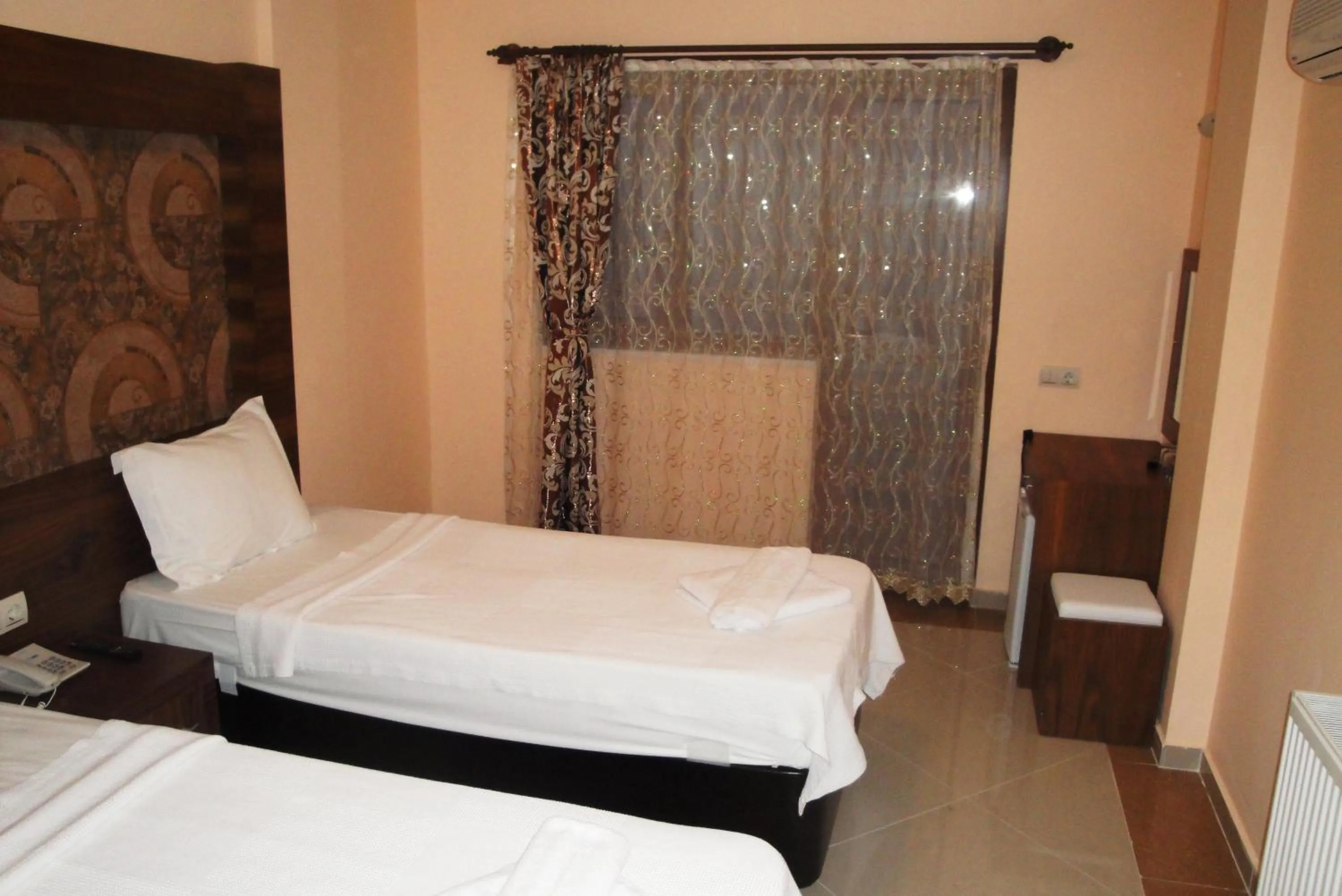 Bed in Dinara Apart Hotel