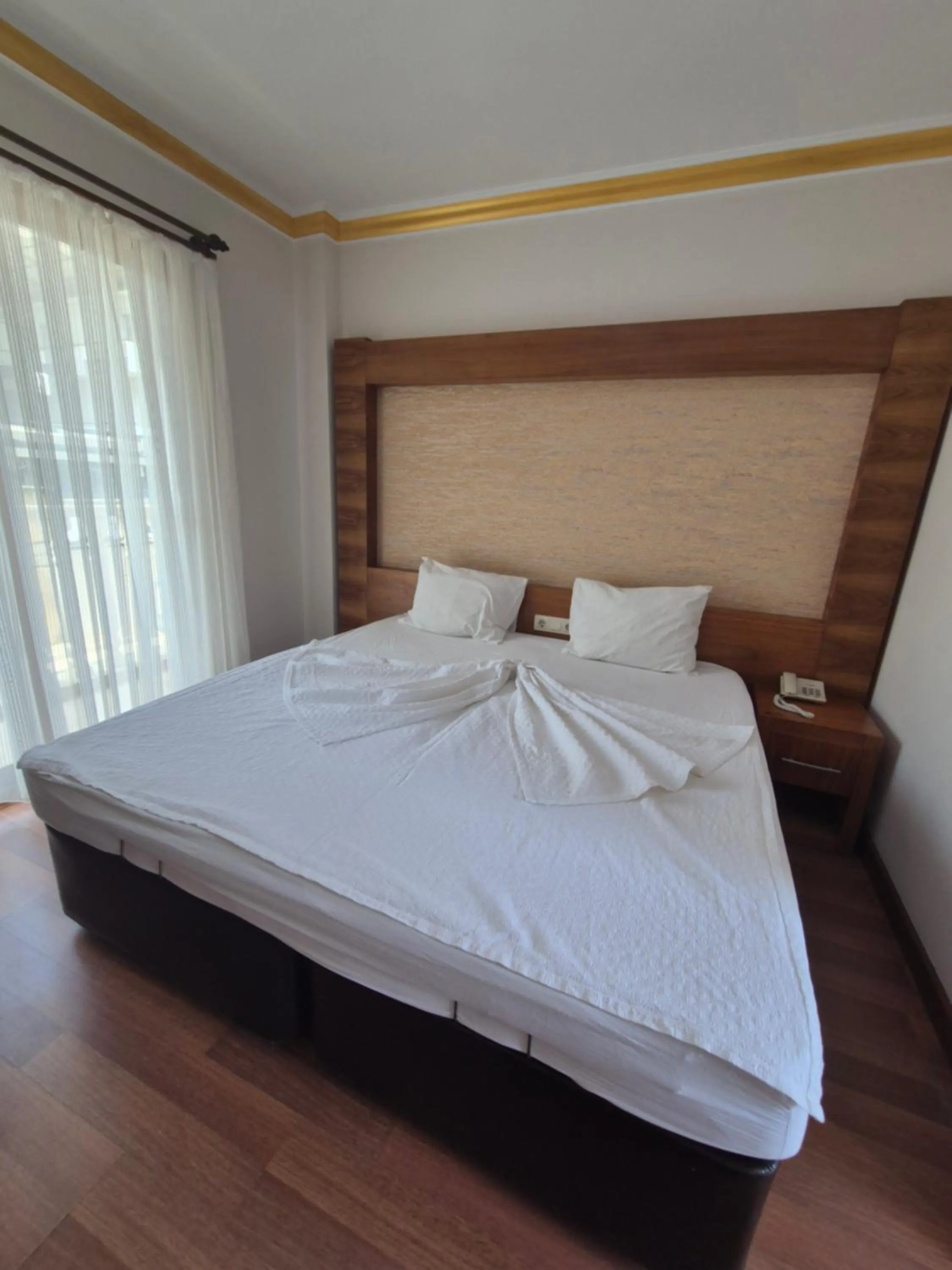 Bed in Dinara Apart Hotel