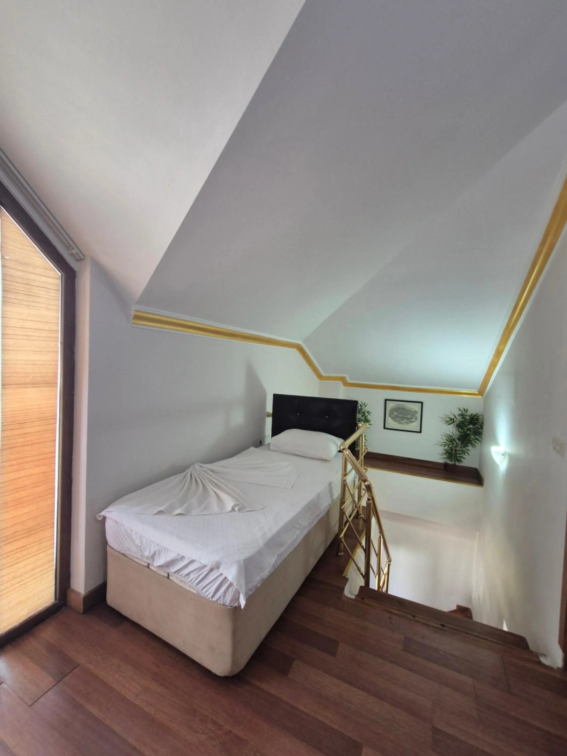 Bed in Dinara Apart Hotel