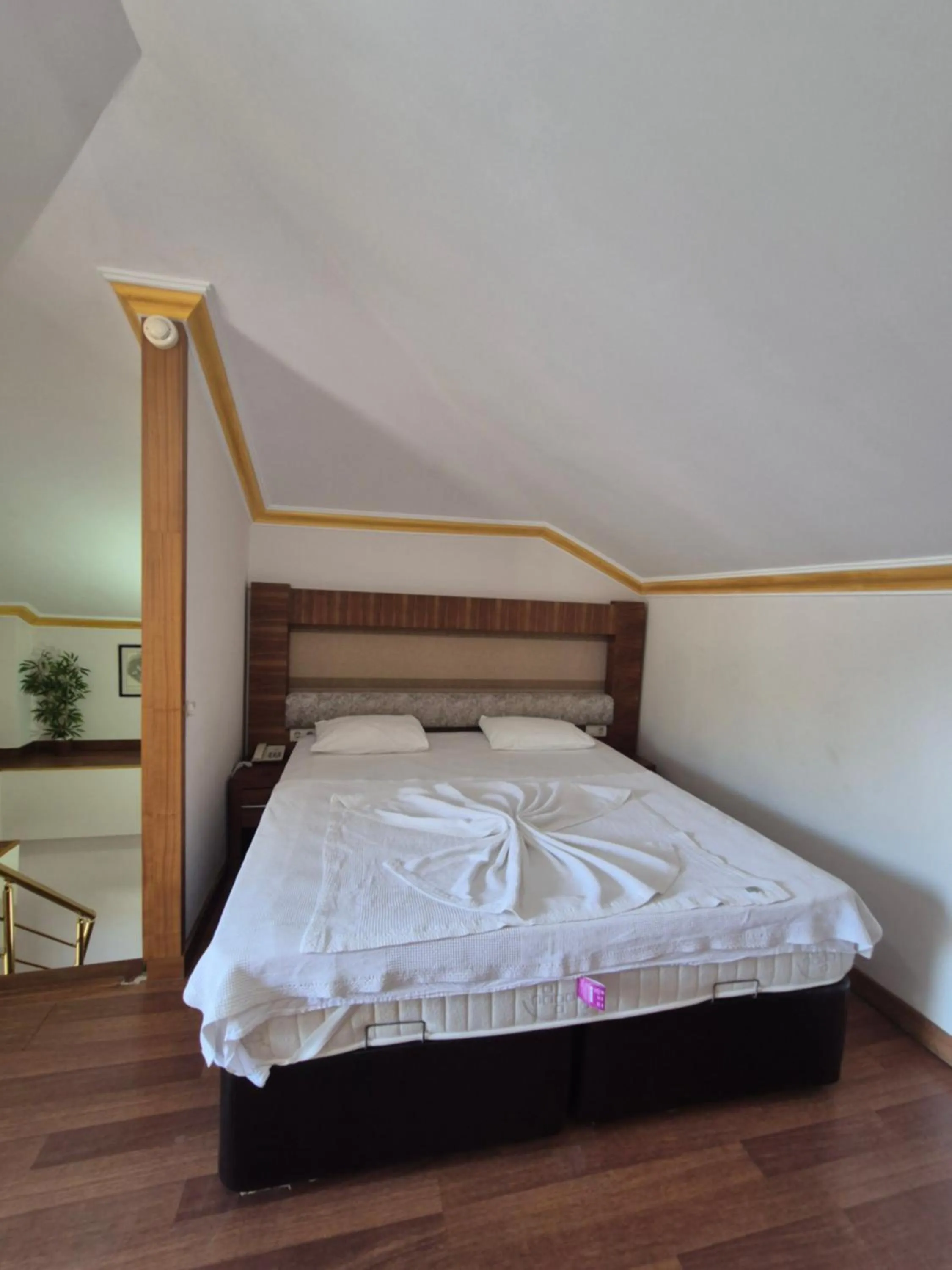 Bed in Dinara Apart Hotel