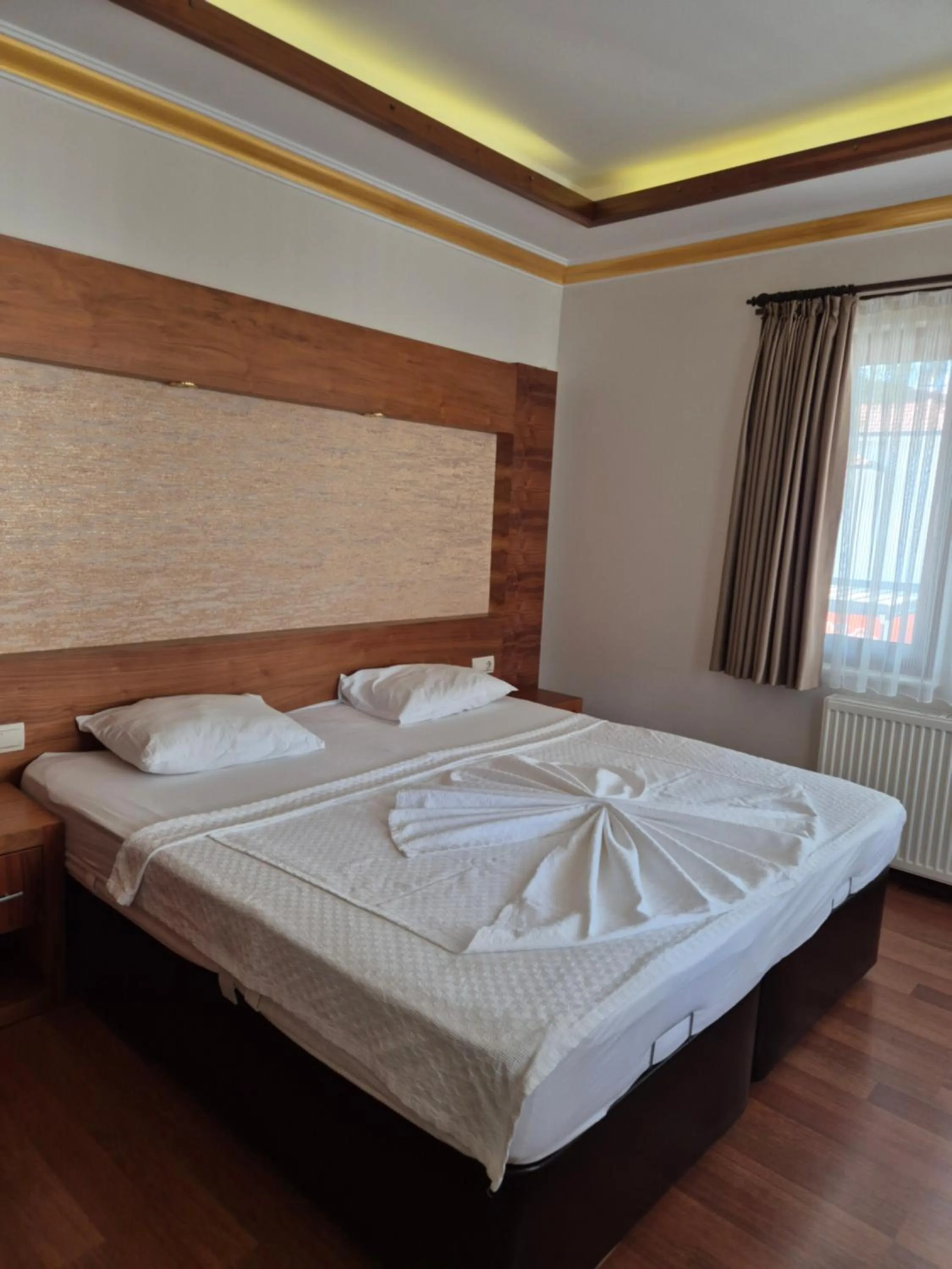 Bed in Dinara Apart Hotel