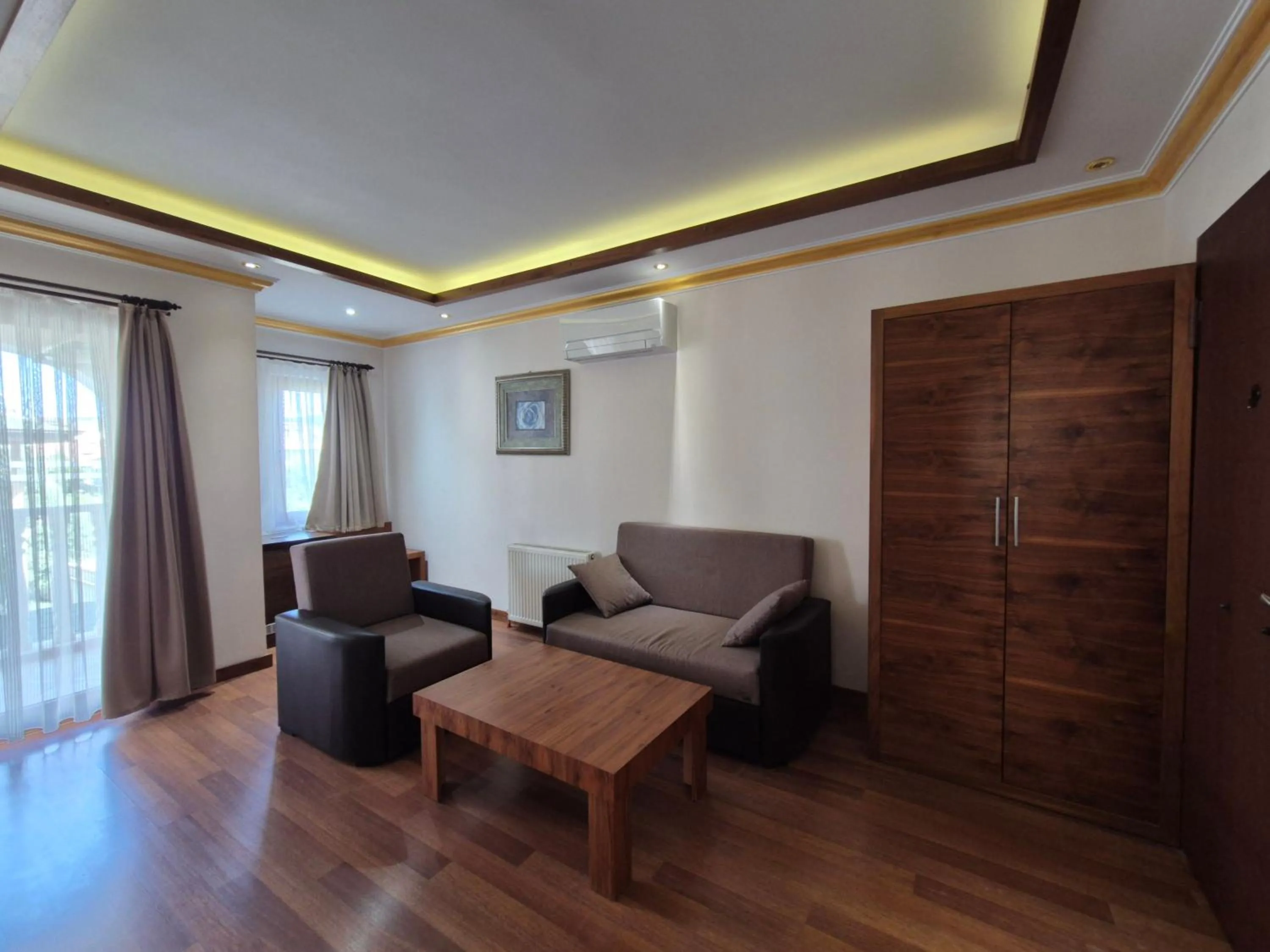 Seating area in Dinara Apart Hotel