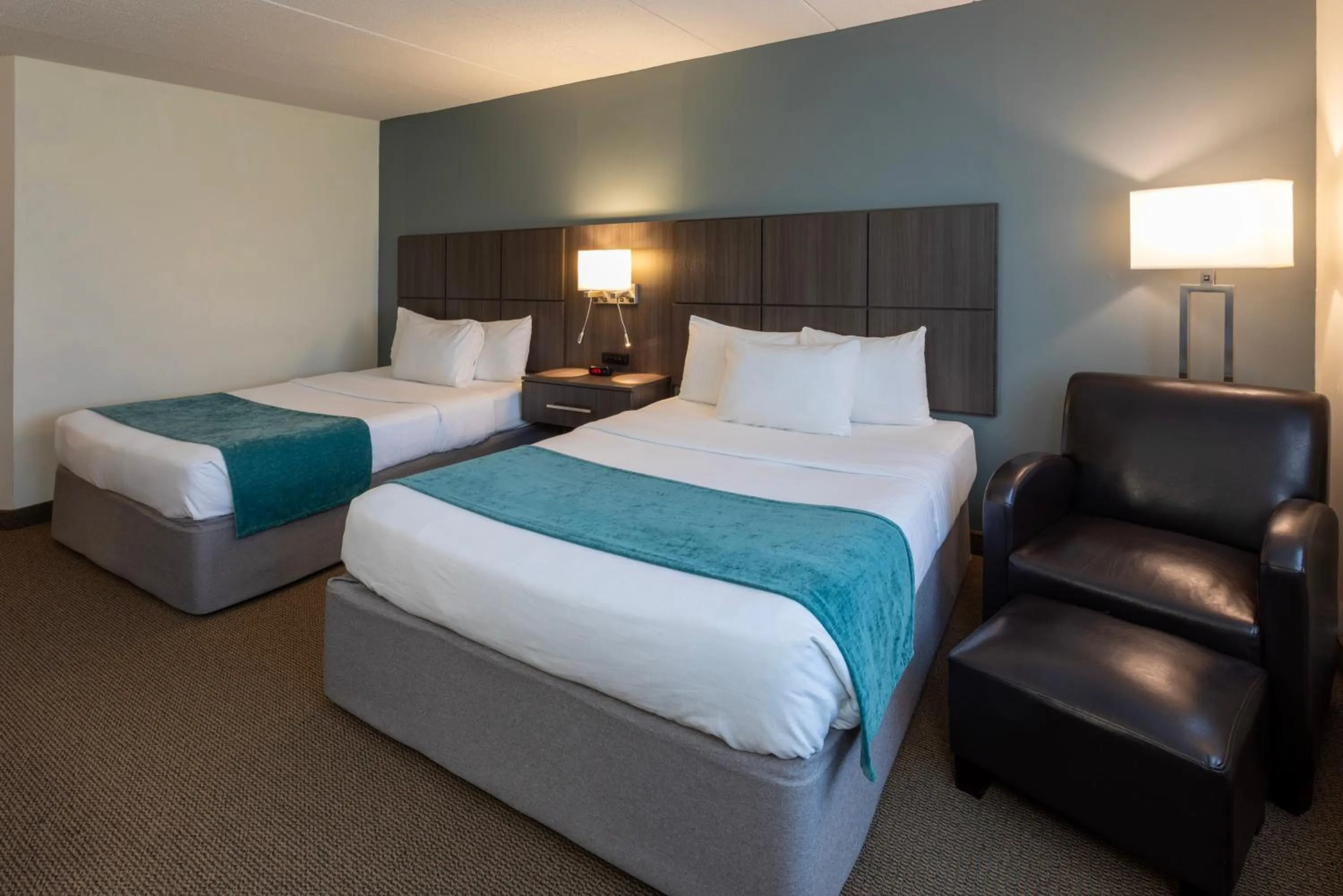 Bed in Paynesville Inn & Suites