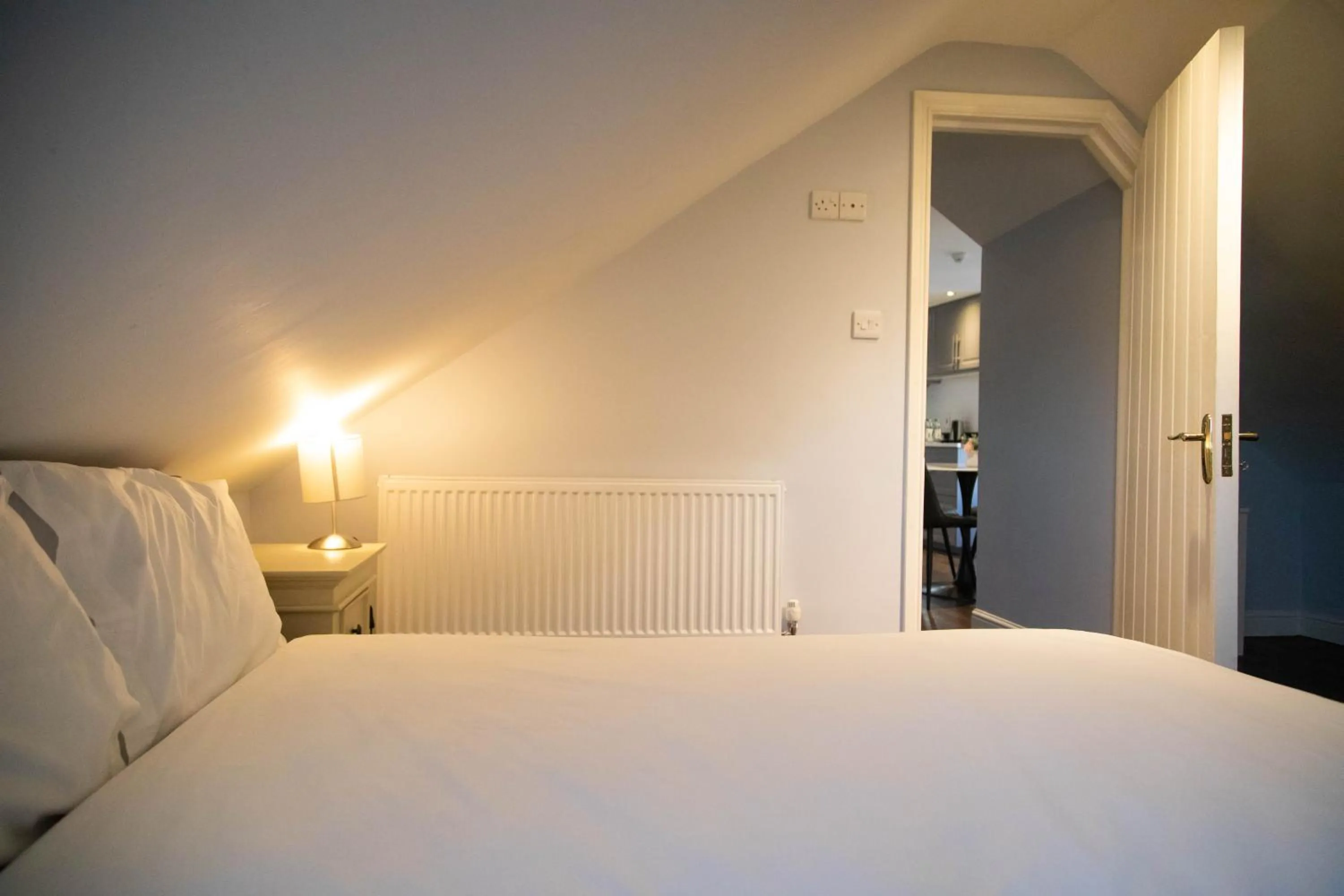 Bed in Molloys Apartments