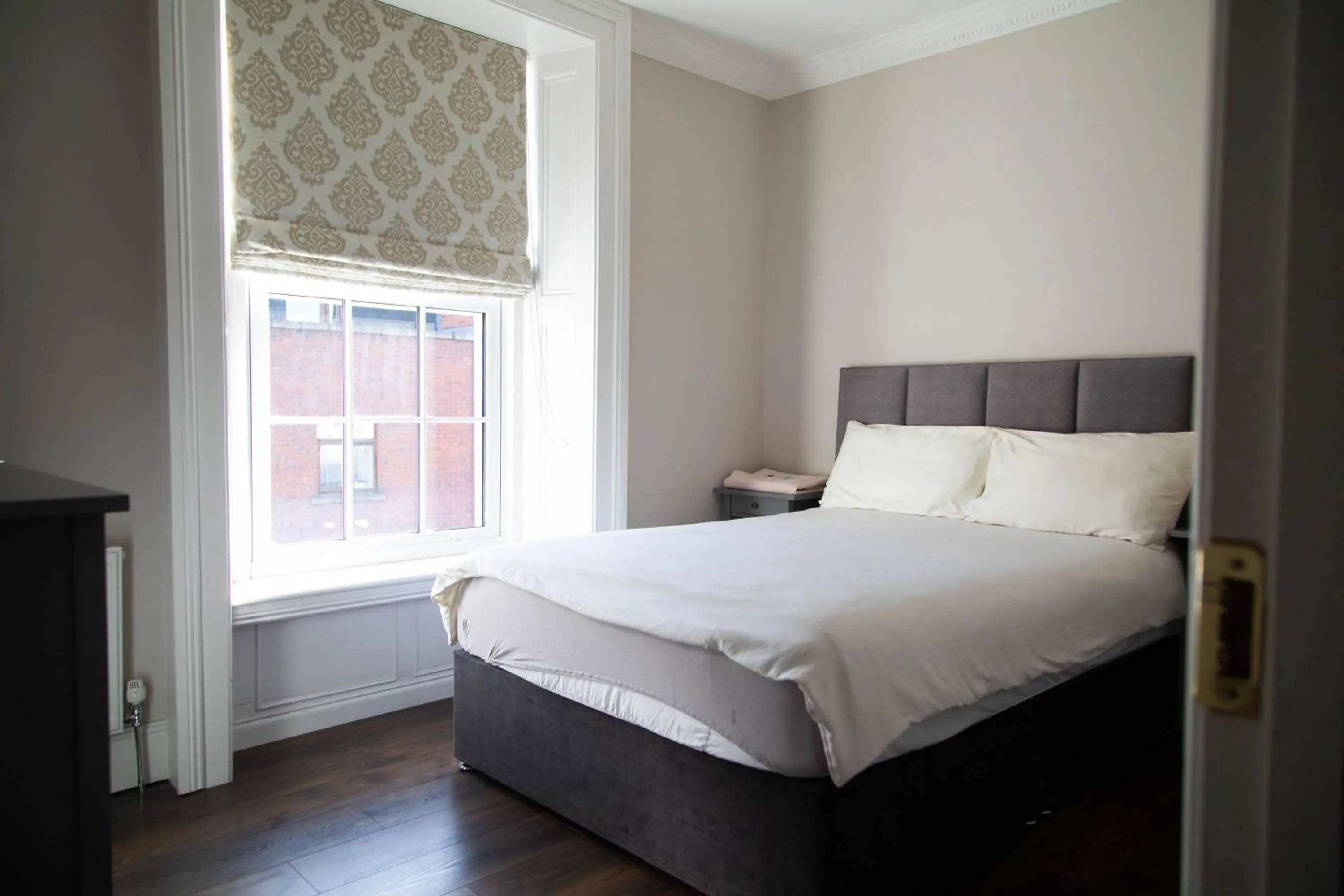 Bed in Molloys Apartments