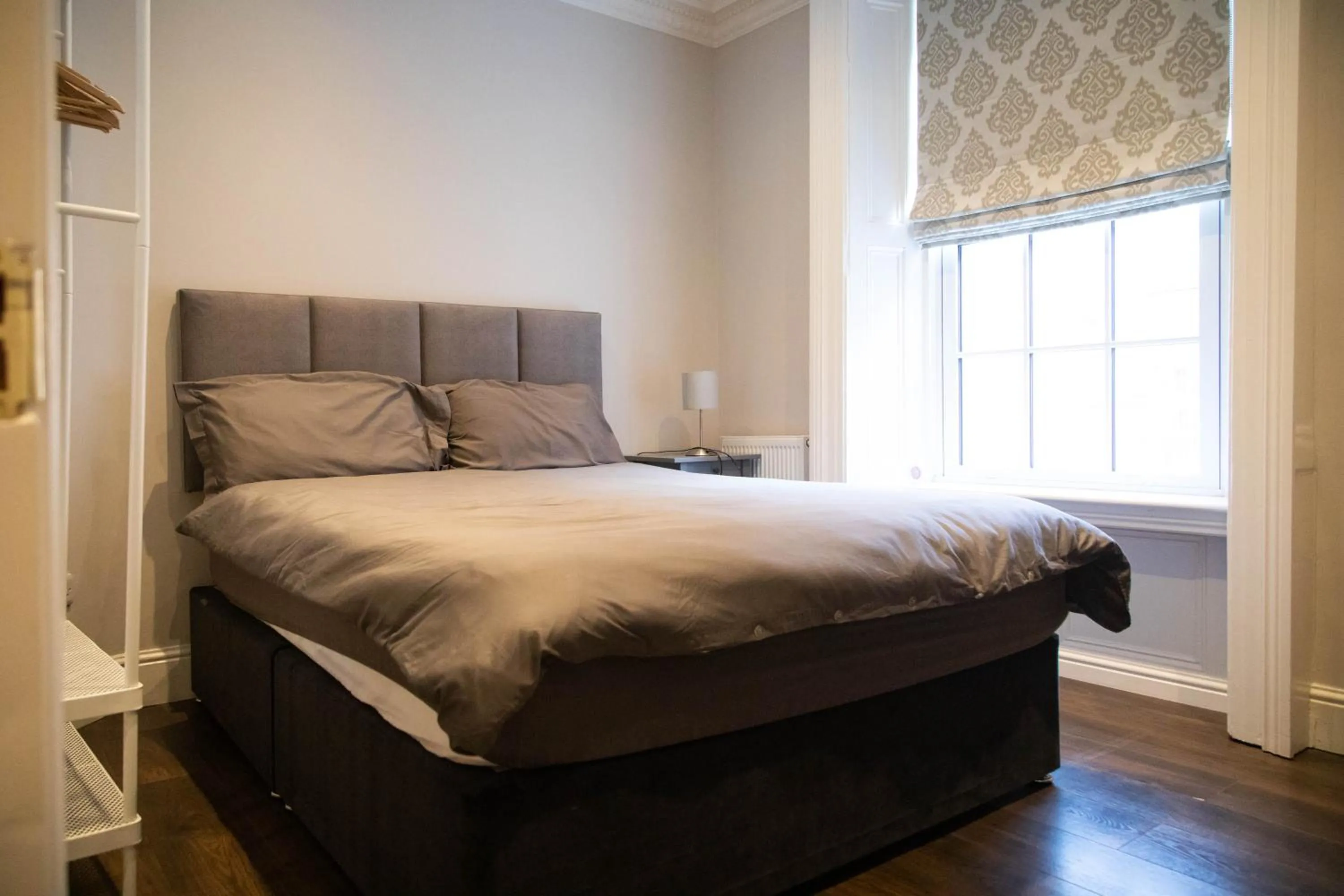 Bed in Molloys Apartments