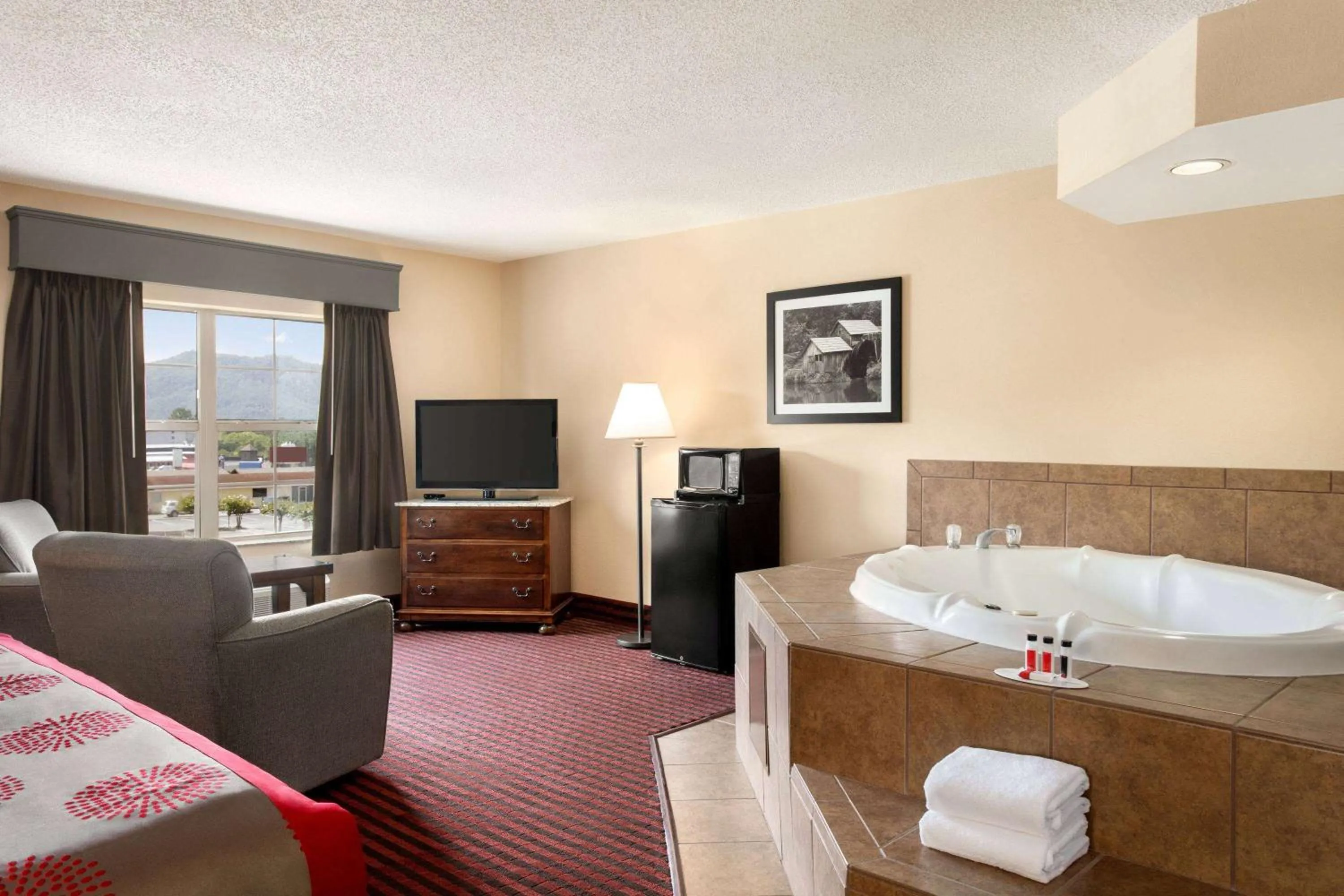 Photo of the whole room, Bed in Ramada by Wyndham Pigeon Forge North