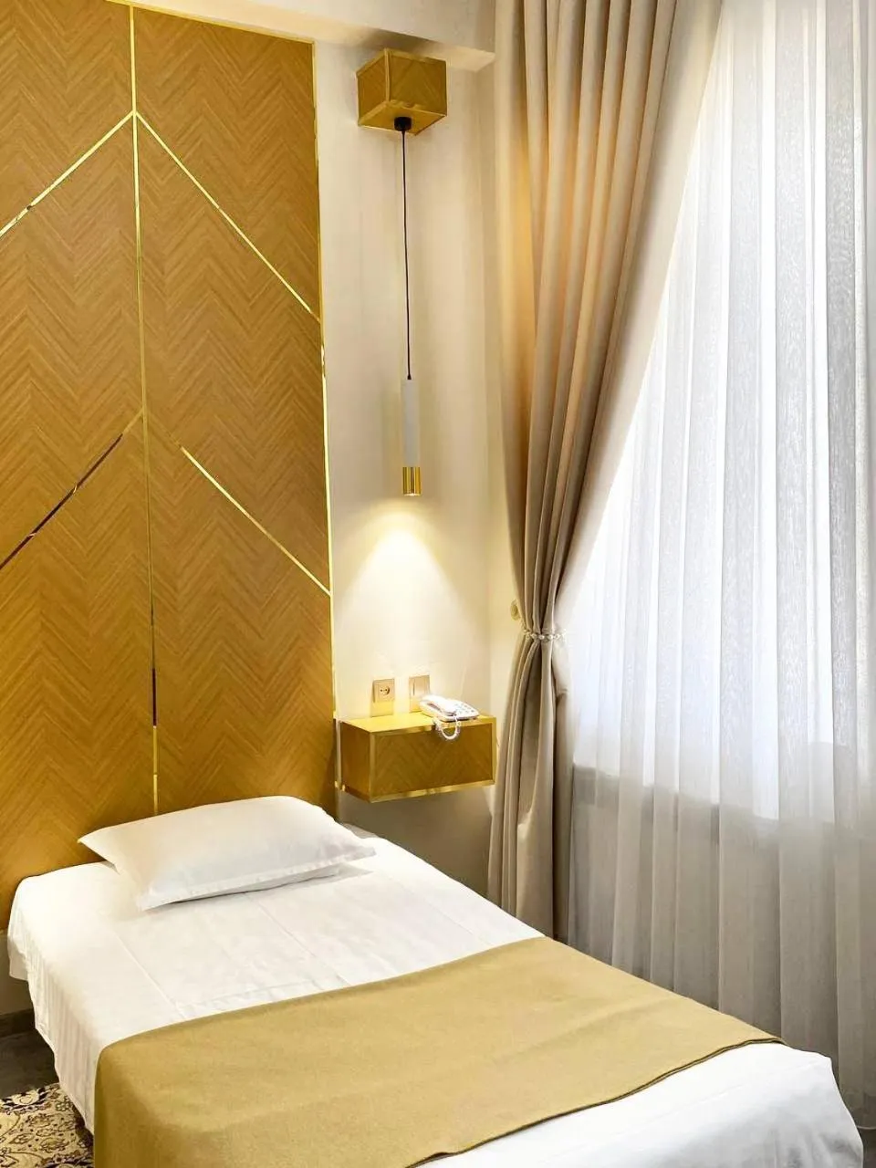 Bed in Hotel KARAVAN