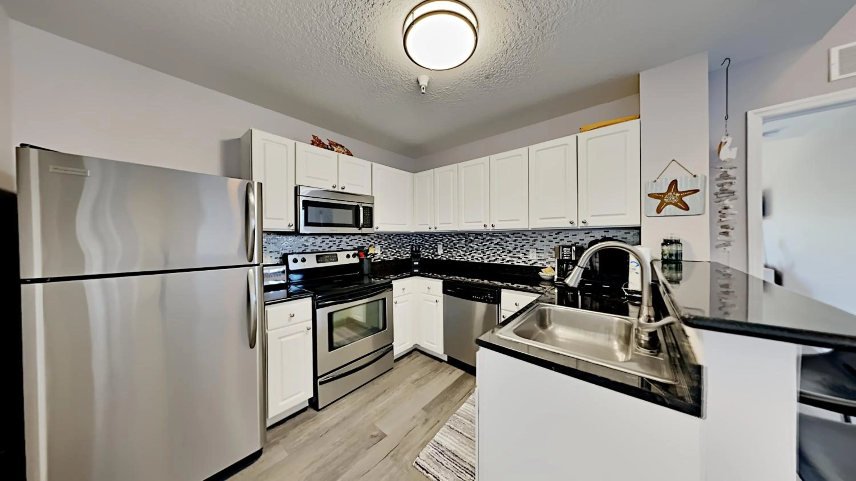 Kitchen or kitchenette in Madeira Bay Resort II by Travel Resort Services