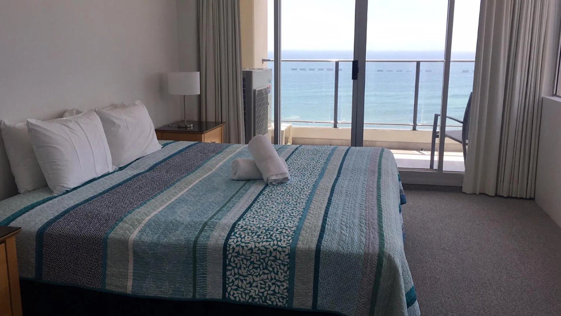 Bed in The Penthouses Apartments