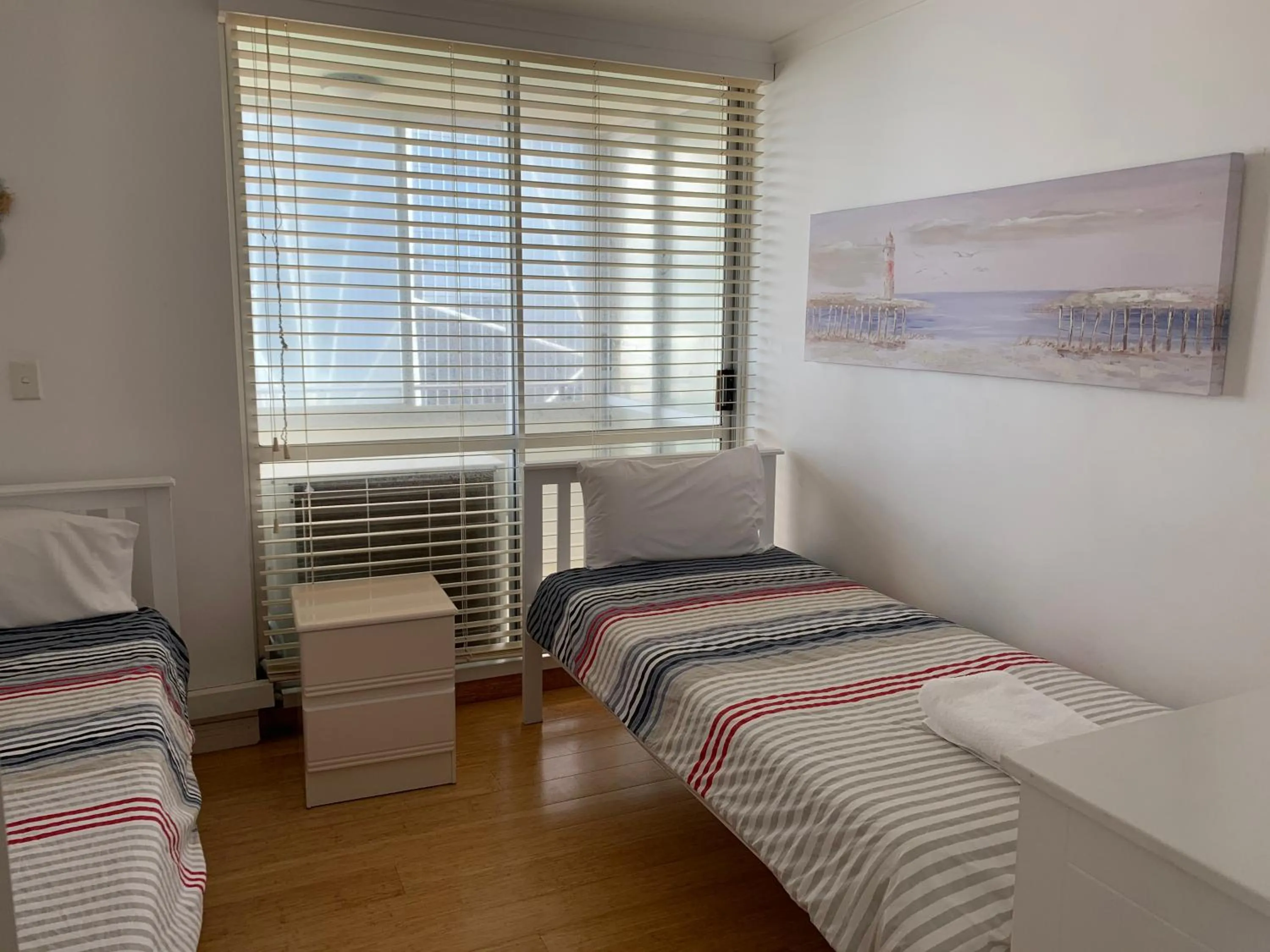 Bed in The Penthouses Apartments