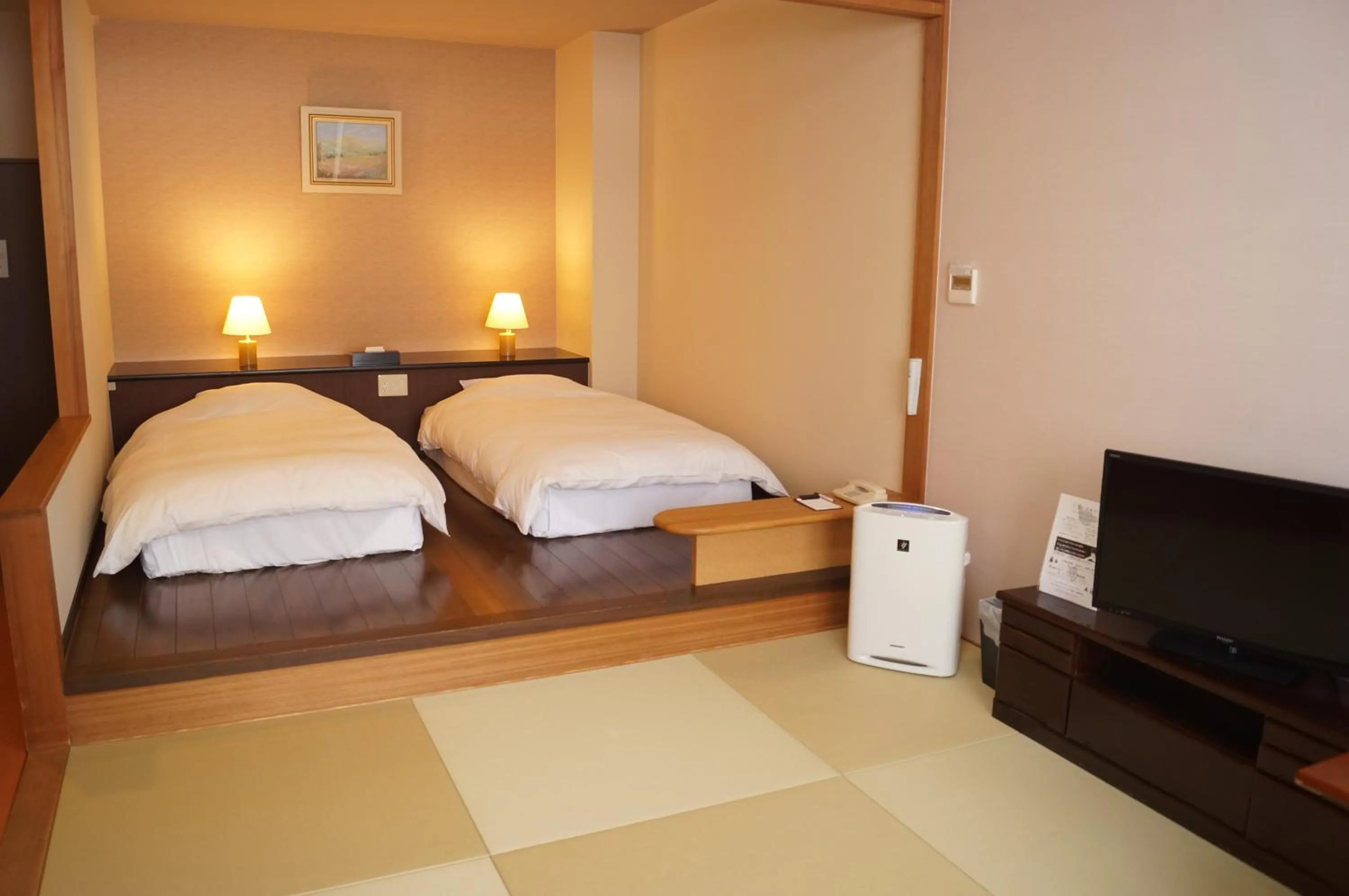 Bed in Nozawa Grand Hotel