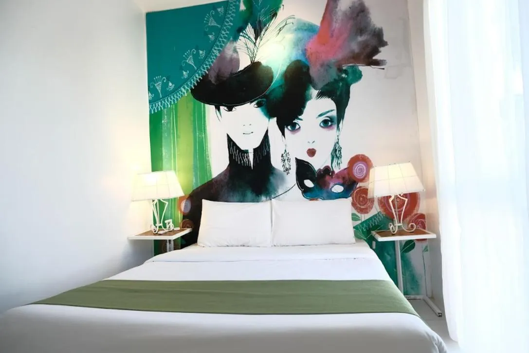 Bed in La Bella Boutique Hotel