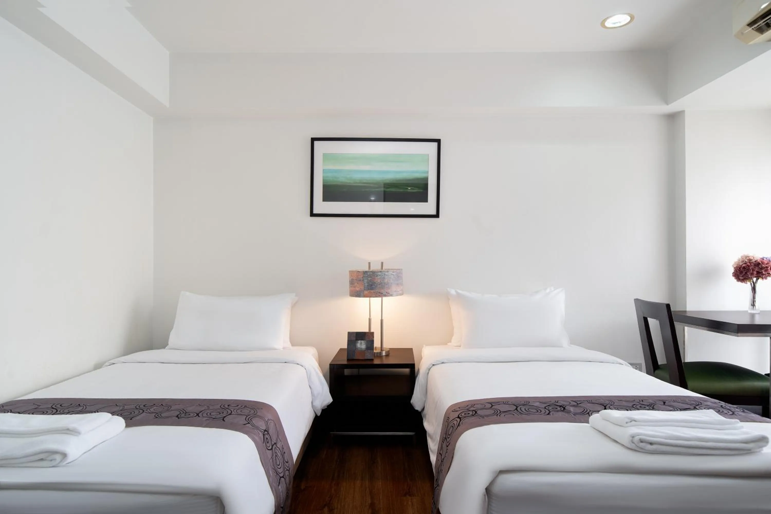 Bed in Lily Hotel Bangkok